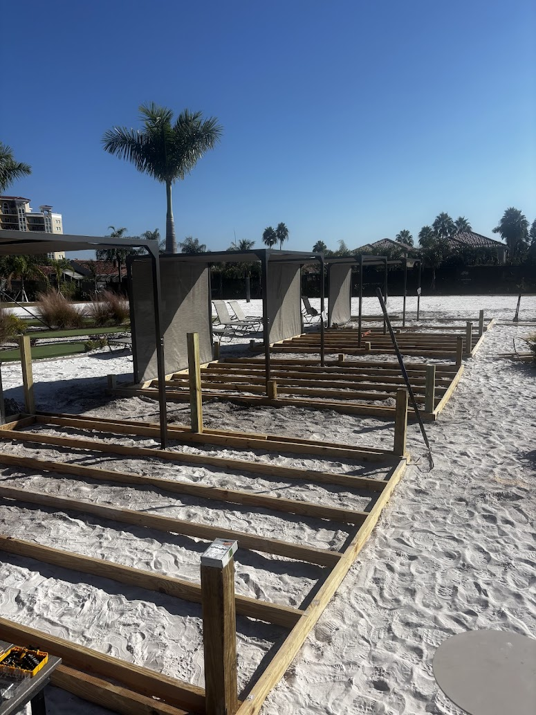 Custom beachfront cabana framing by Abundance of Sunshine Inc. in the St. Petersburg–Clearwater area, built over a prepared and stabilized sand base.