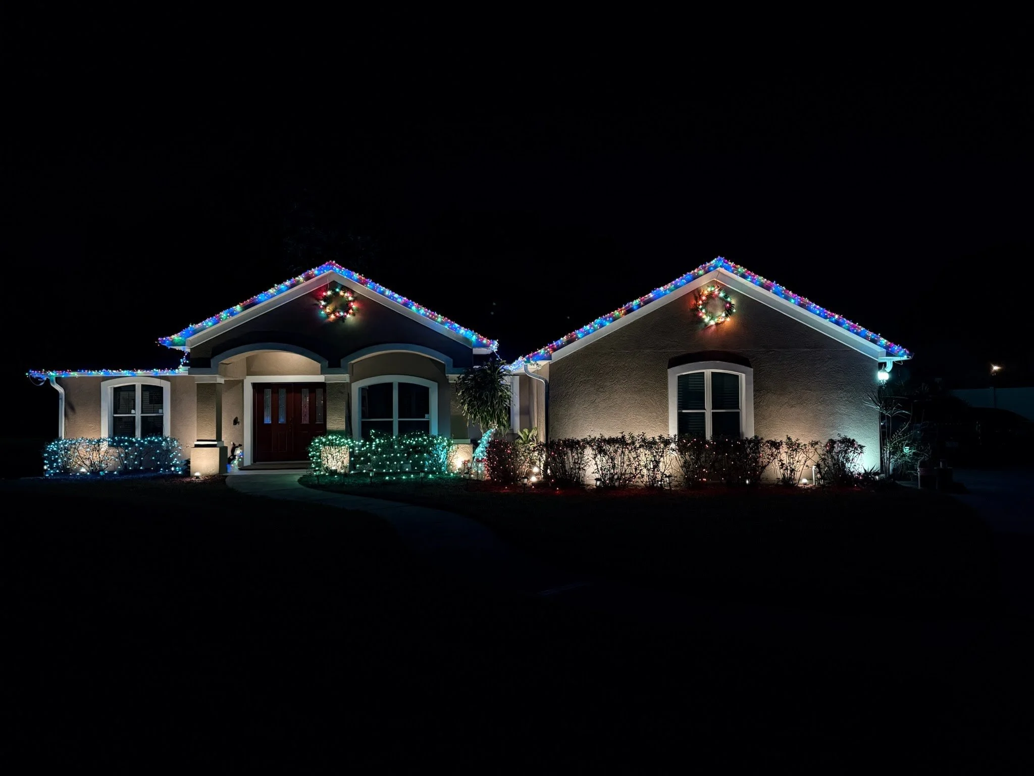 Professional seasonal holiday lighting installed on a residential home in the Tampa Bay area.