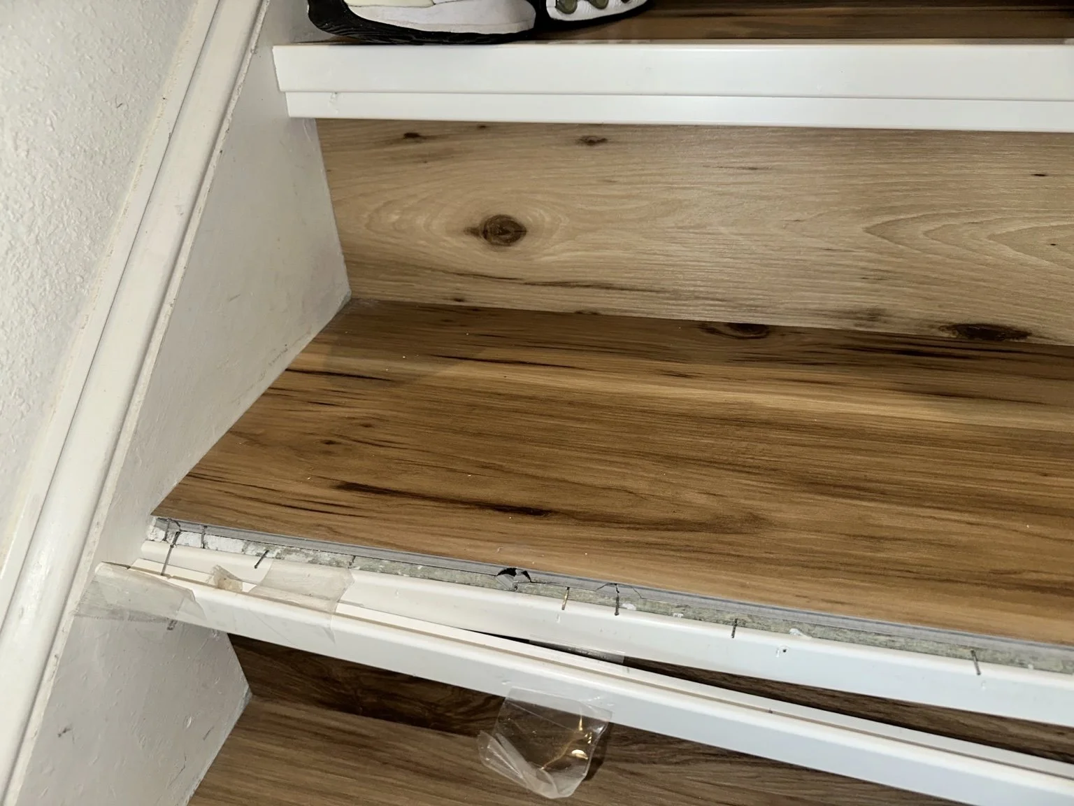 Handyman stair repair completed by Abundance of Sunshine Inc. in FishHawk. We removed improperly installed stair-tread material and nosing, selected a coordinating replacement, and installed the new finish for improved safety and appearance.