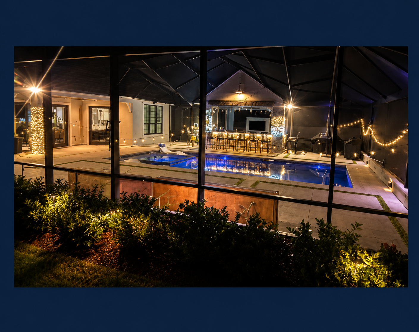 Holiday courtyard lighting around a screened pool and outdoor entertaining area in Tampa Bay.