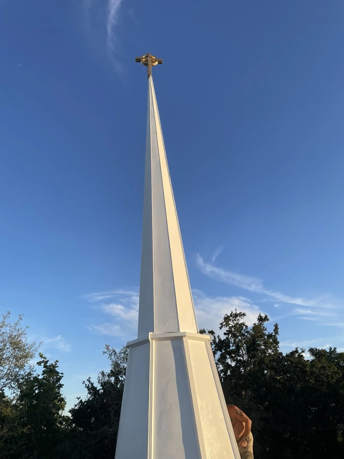 Completed post-hurricane restoration at the Korean Presbyterian Church of Tampa by Abundance of Sunshine Inc., including repairs and painting of the steeple and cross, roof flashing repairs, and restoration of the lightning rod and related electrical