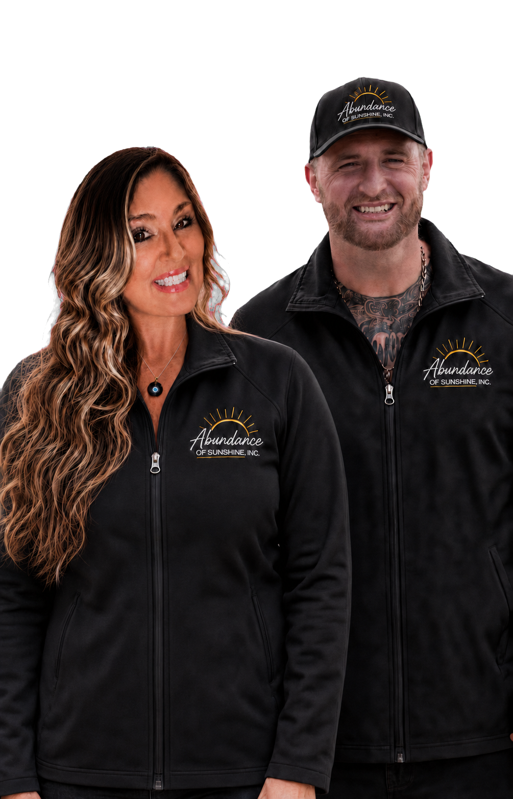 Krista Sunshine and Josh, co-owners of Abundance of Sunshine Inc., wearing branded black company jackets
