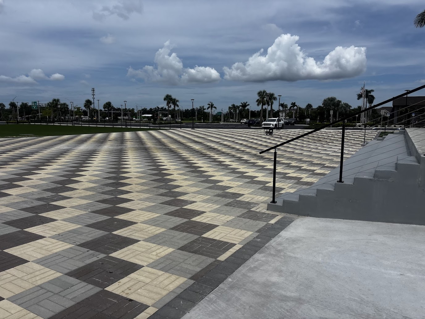 Completed custom checkerboard paver game court built by Abundance of Sunshine Inc. at a resort in the Sarasota–Bradenton area, featuring a professionally prepared base and contrasting paver design.