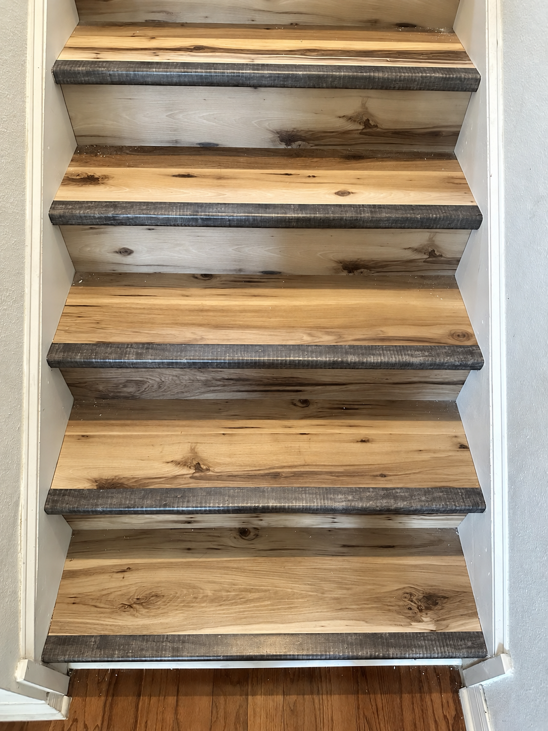 New coordinating stair nosing installed by Abundance of Sunshine Inc. at a FishHawk home, correcting previous workmanship and creating secure, finished stair edges for improved safety and appearance.