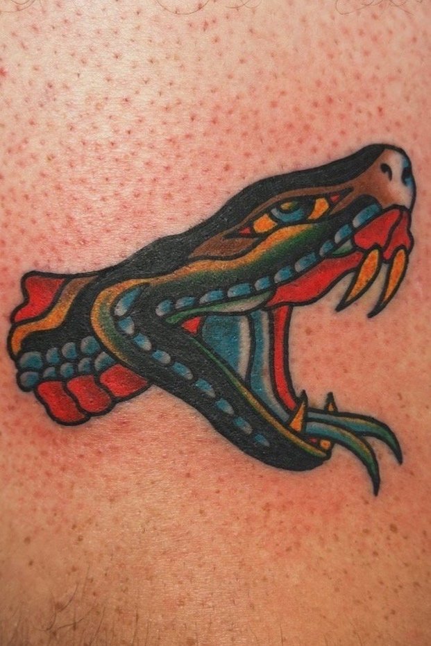 Colorful snake head tattoo with open mouth