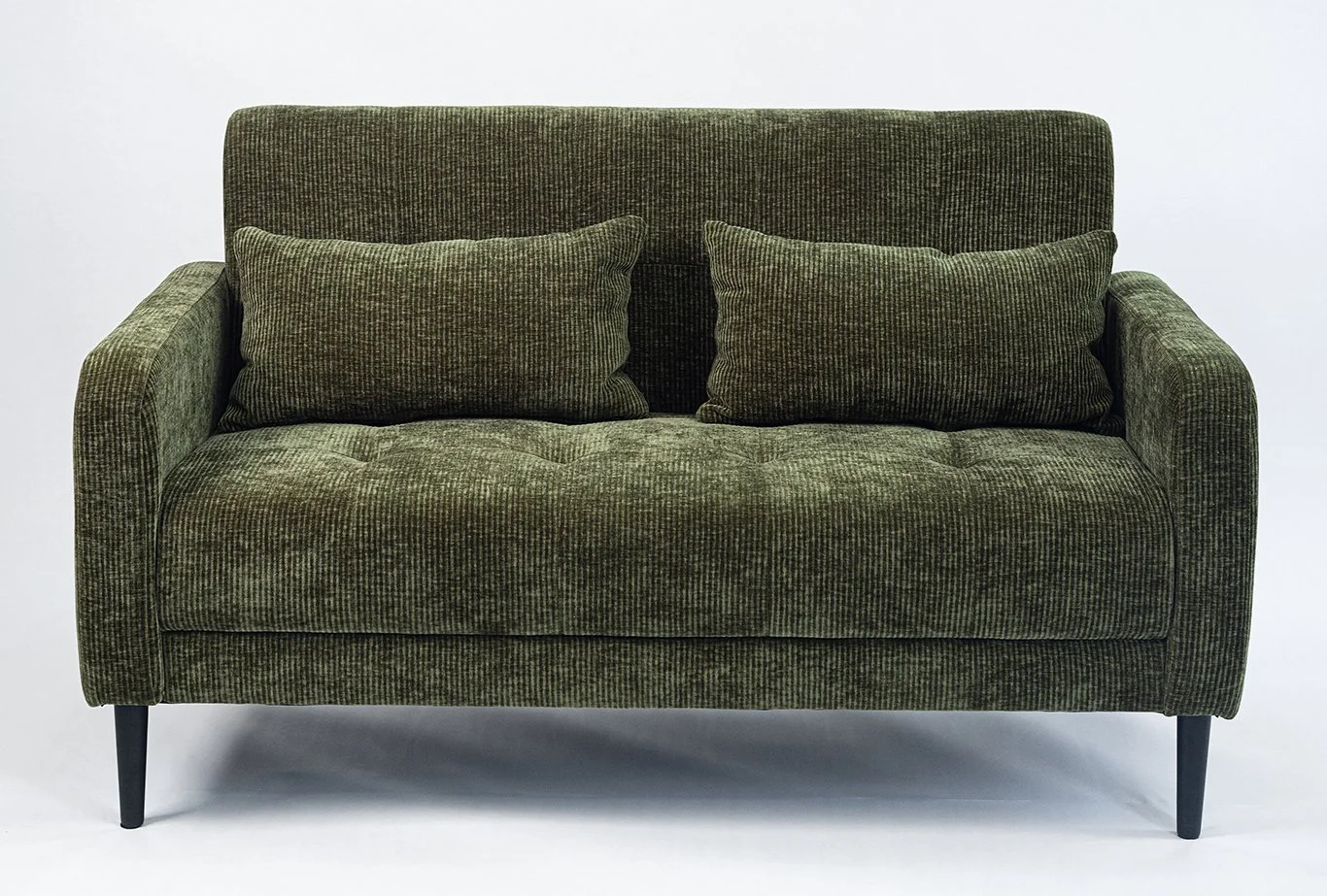 Olive green upholstered loveseat with two matching pillows on a white background.