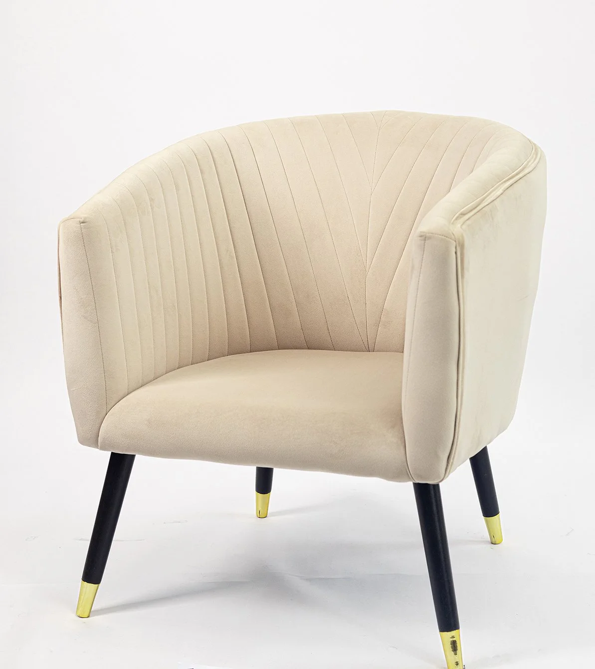 Cream-colored, mid-century modern armchair with black wooden legs and yellow metallic caps
