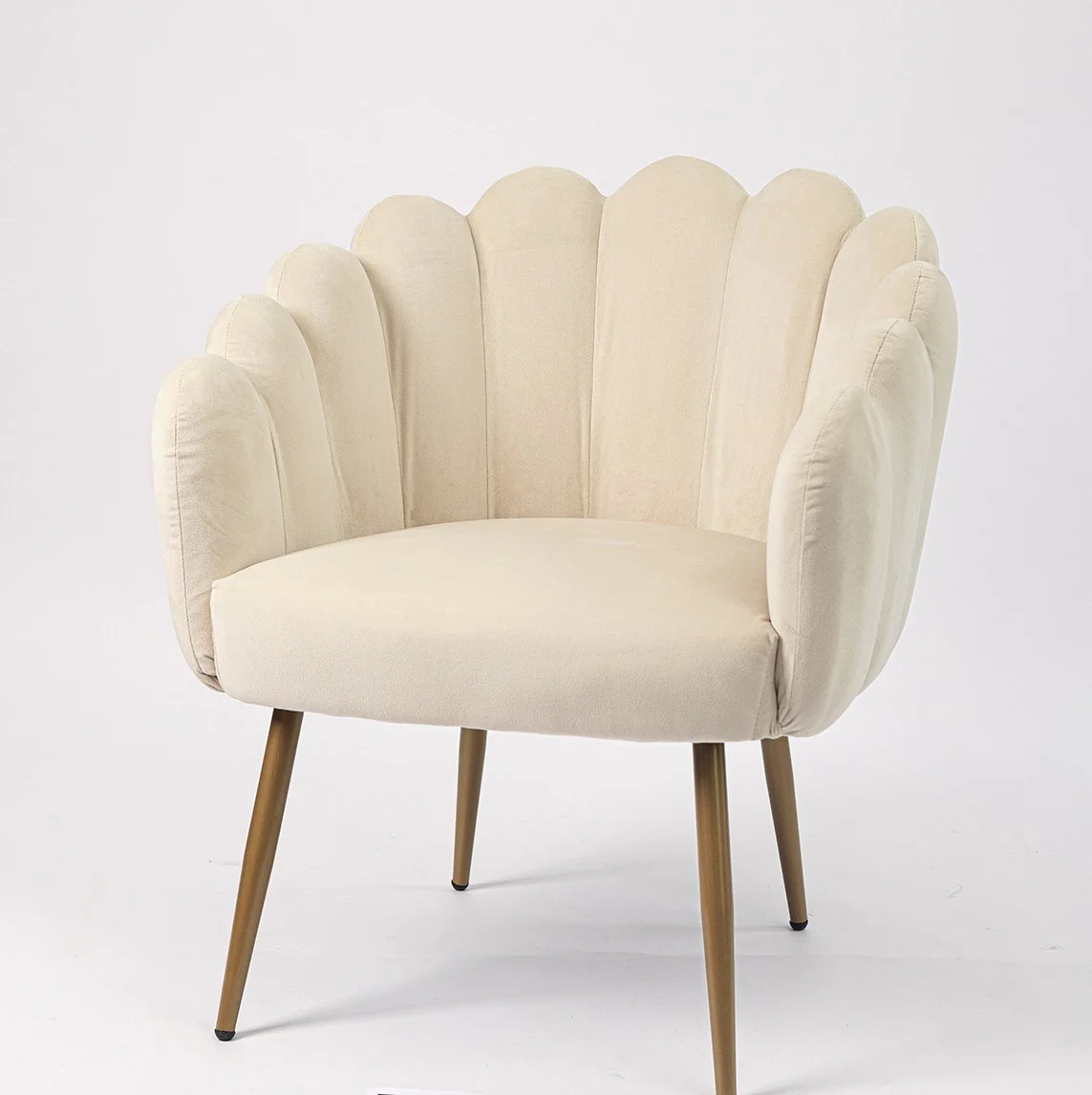 Cream-colored accent chair with a scalloped shell design and wooden legs.