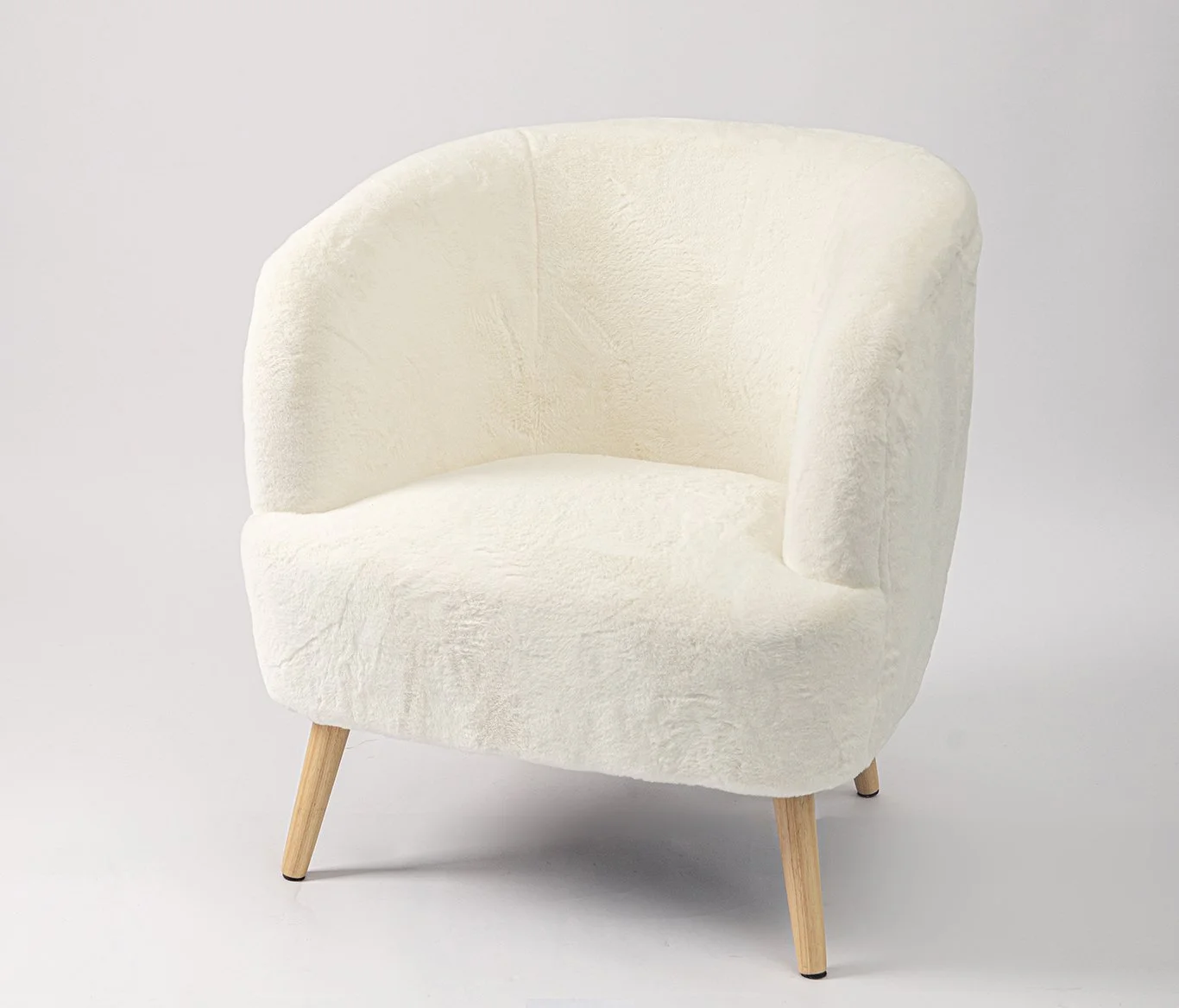 White upholstered armchair with wooden legs on a plain light background.