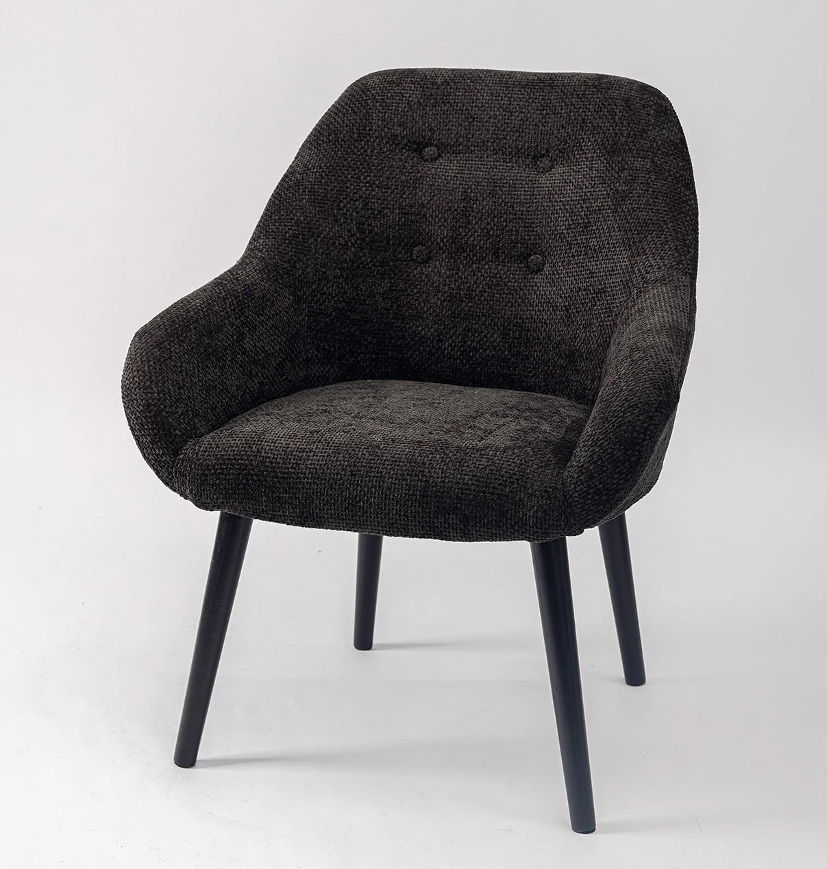 Black upholstered armchair with curved wooden legs on a white background.