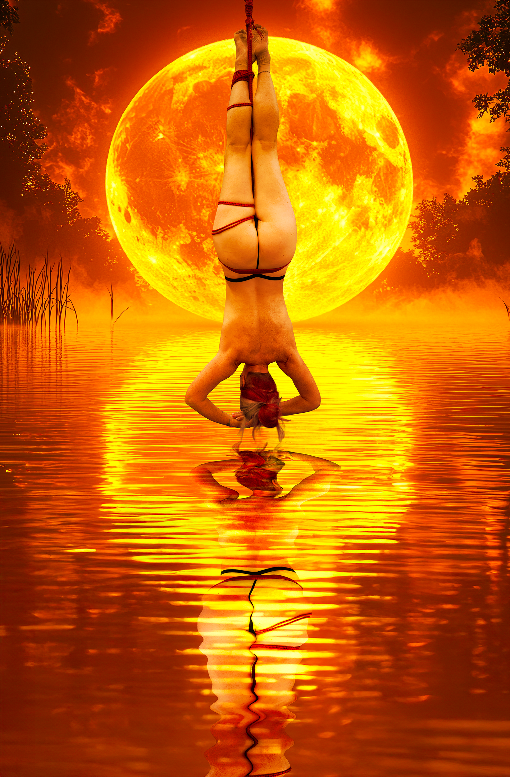 A woman in black bikini with red hair doing a headstand in water, with a large glowing orange moon in the background and reflection on the water.