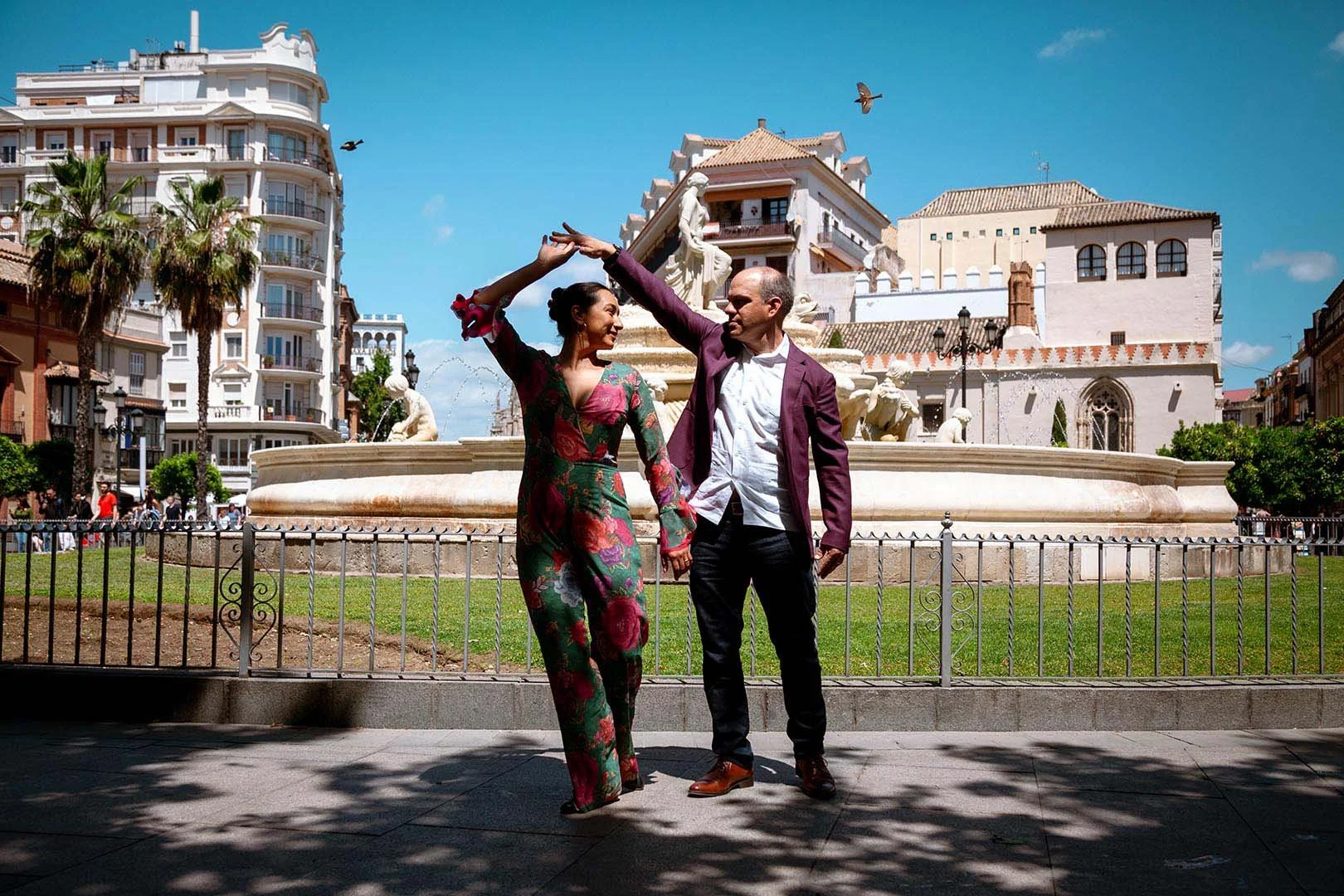 A just engaged couple dancing in Seville's Santa Cruz Neighborhood.