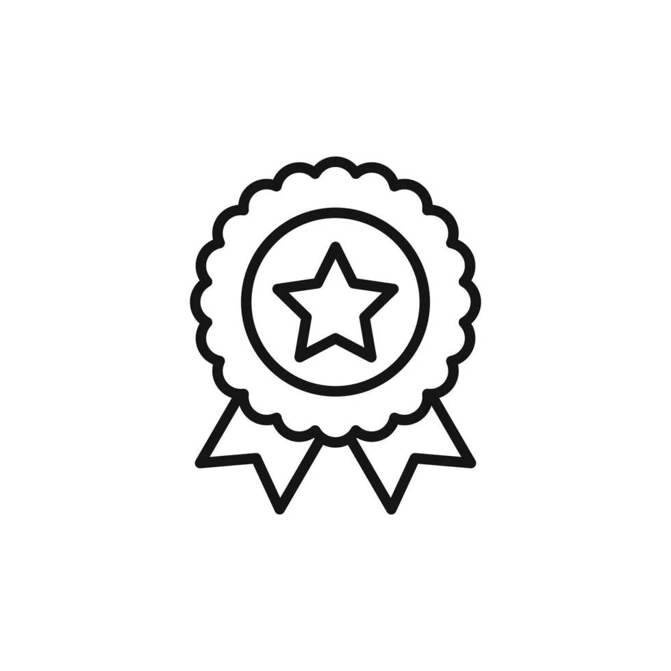 Person with curly hair wearing glasses, smiling indoors.