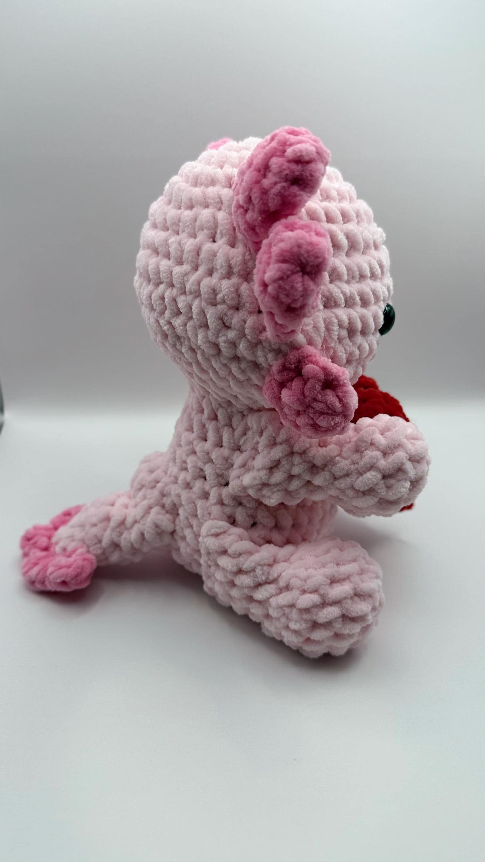 Soft and cuddly handmade crochet axolotl plush, a perfect gift for amphibian lovers.