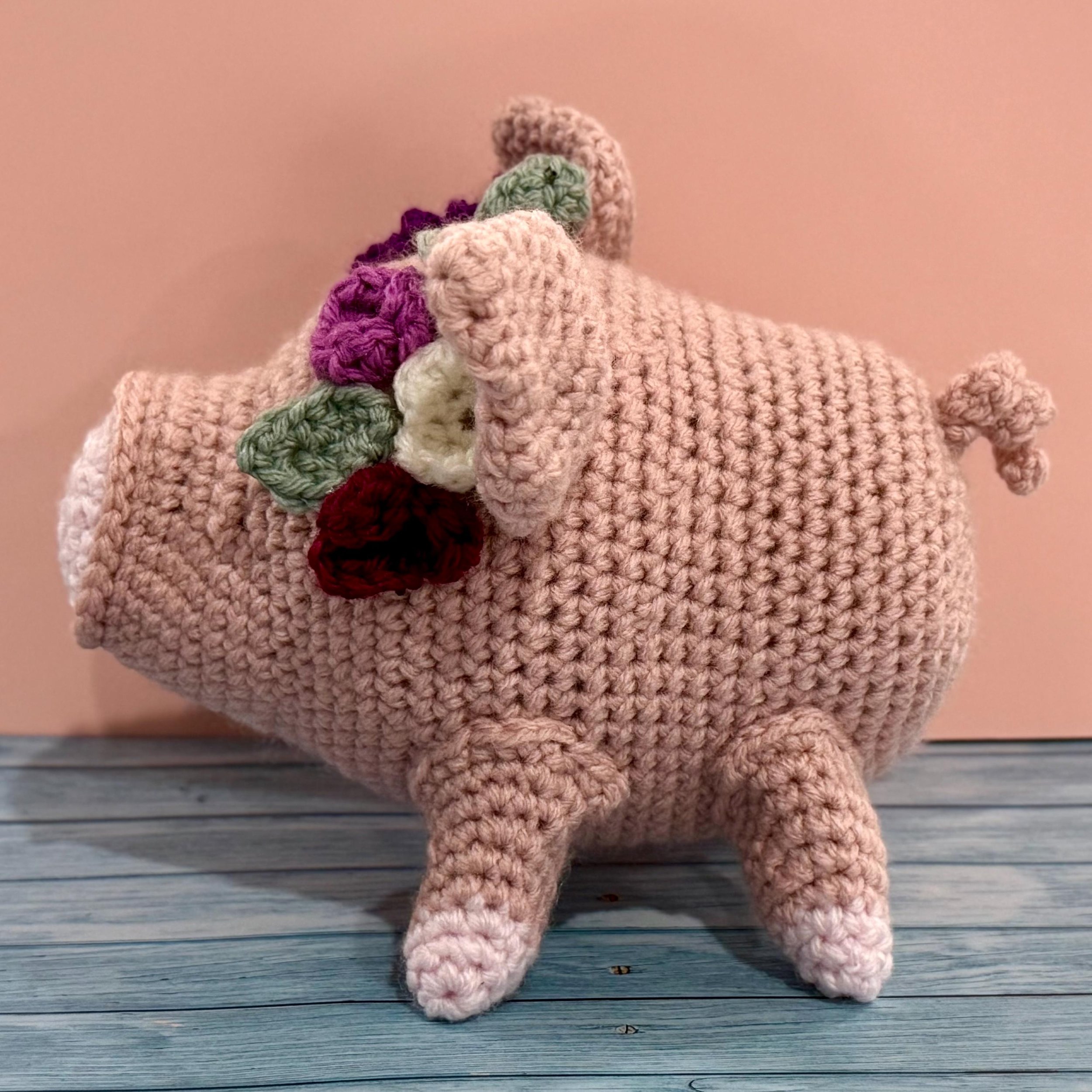Adorable handmade crochet pig plushie, a perfect farm animal toy or gift for pig lovers.