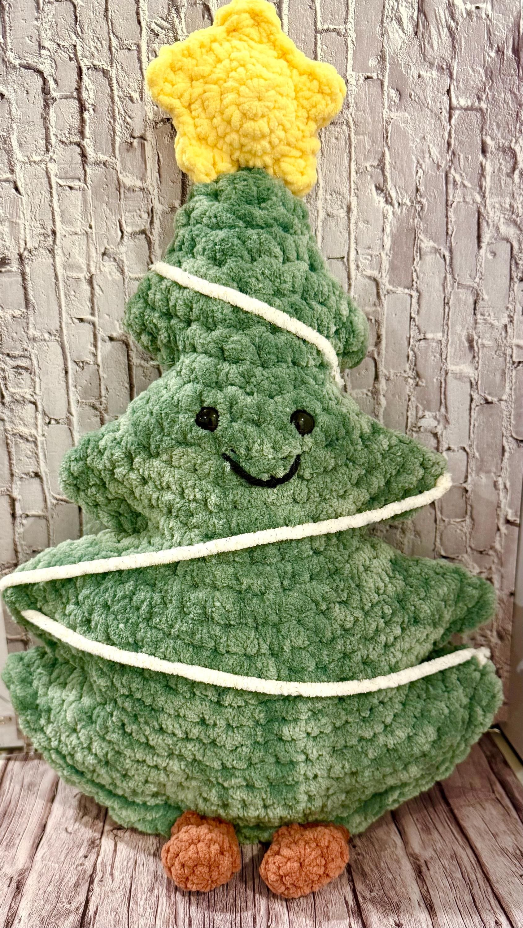 Handmade crochet Christmas tree plushies, perfect for decorating and gifting.