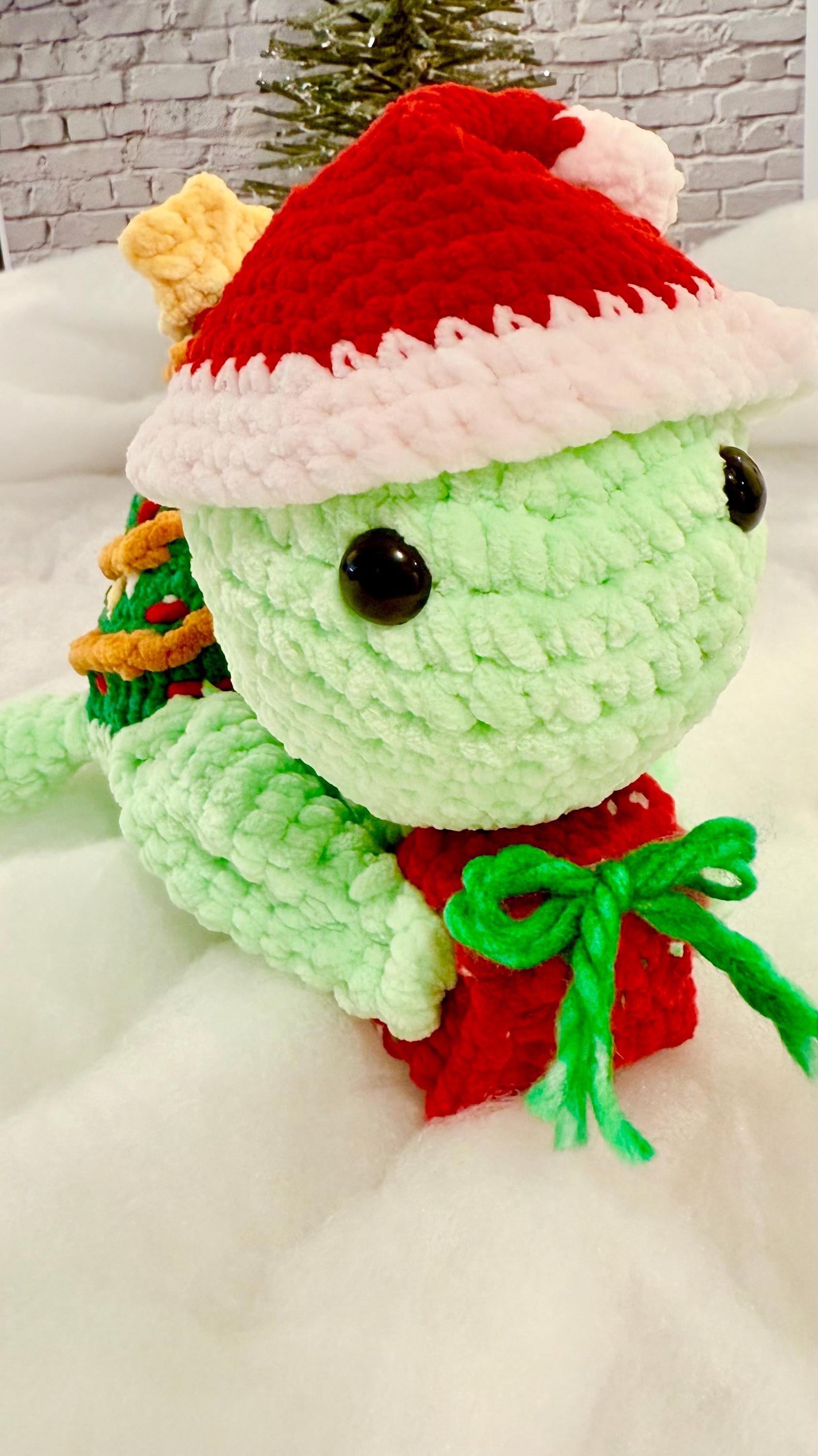 Festive handmade crochet turtle plushies, a unique and adorable Christmas decoration.