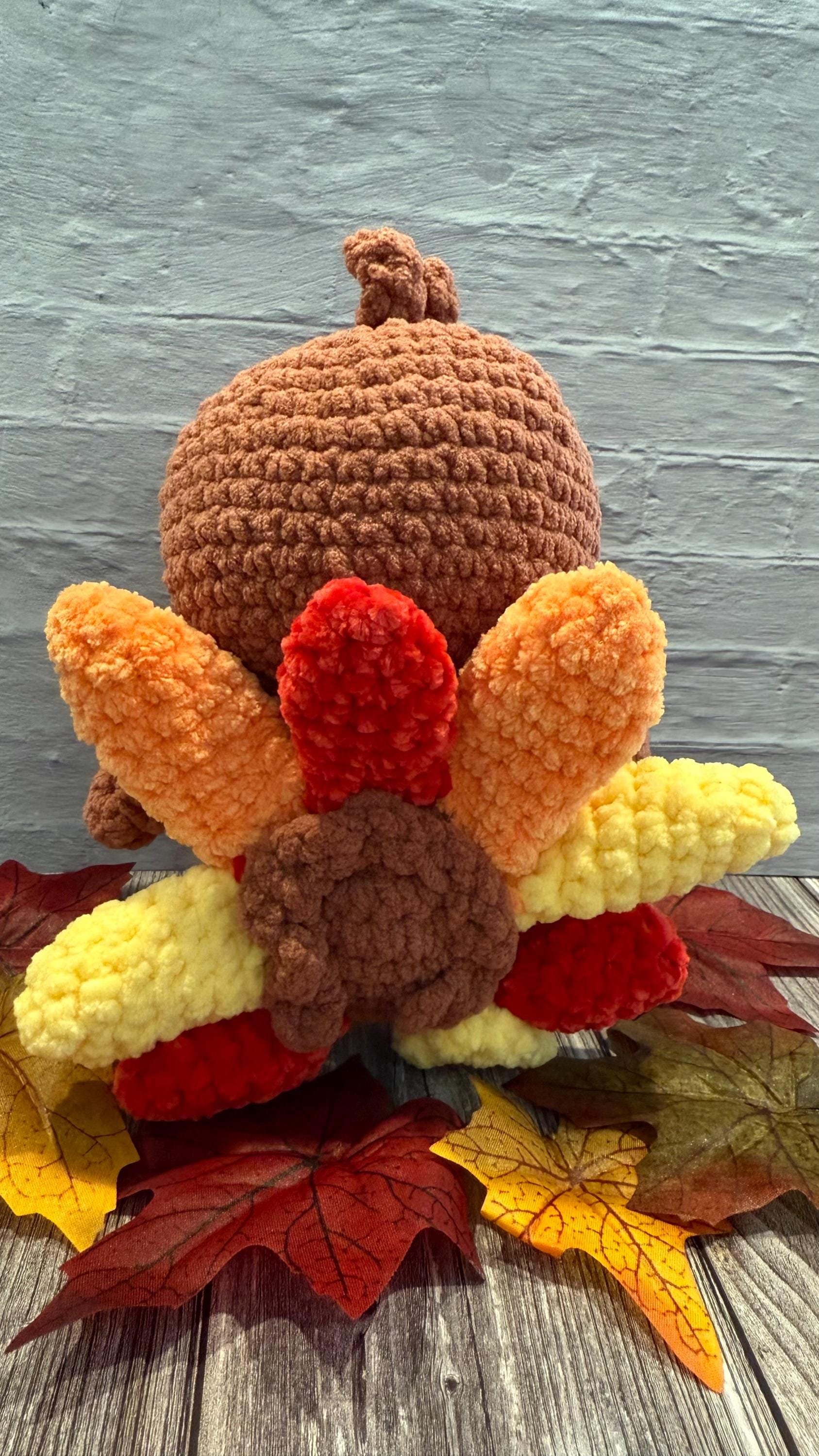 Handmade crochet turkey plushie, a fun and festive Thanksgiving decoration.