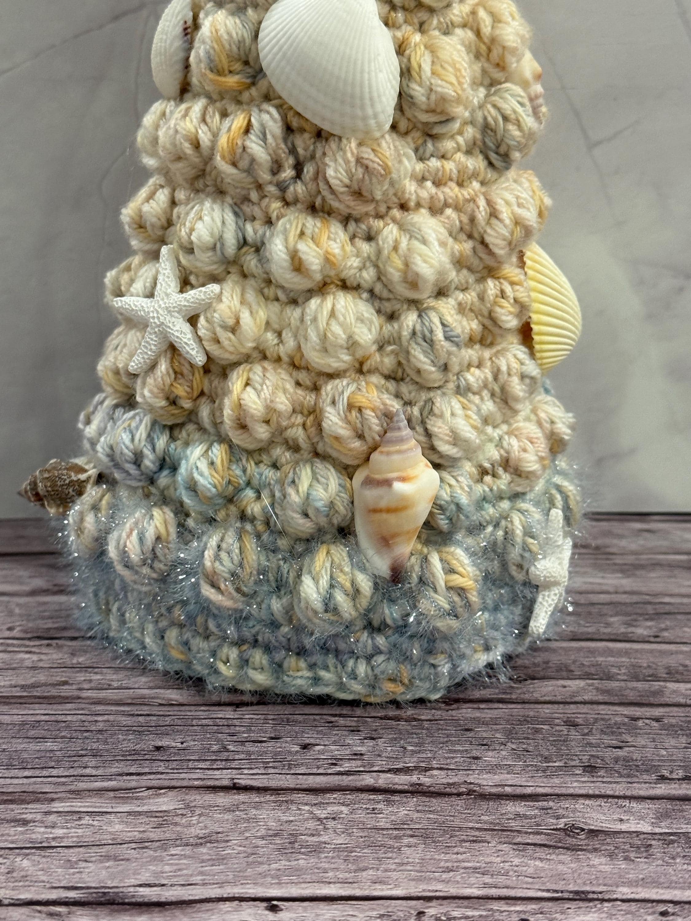 Handmade crochet Christmas tree with a beachy twist, perfect for coastal holiday decor.