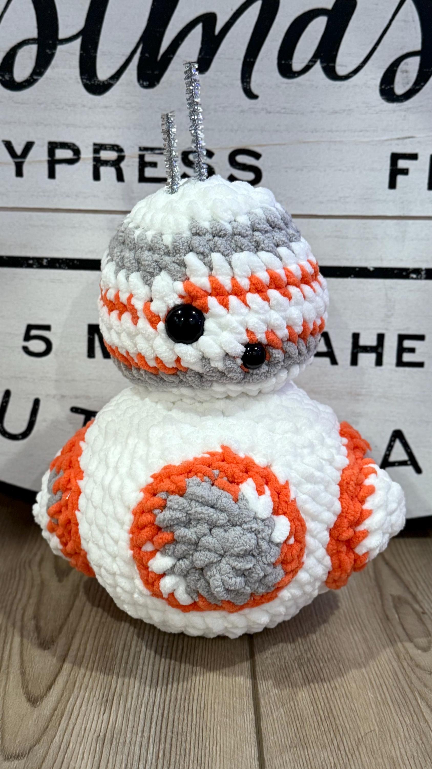 Cute handmade crochet robot plushie, a perfect gift for sci-fi fans and collectors.