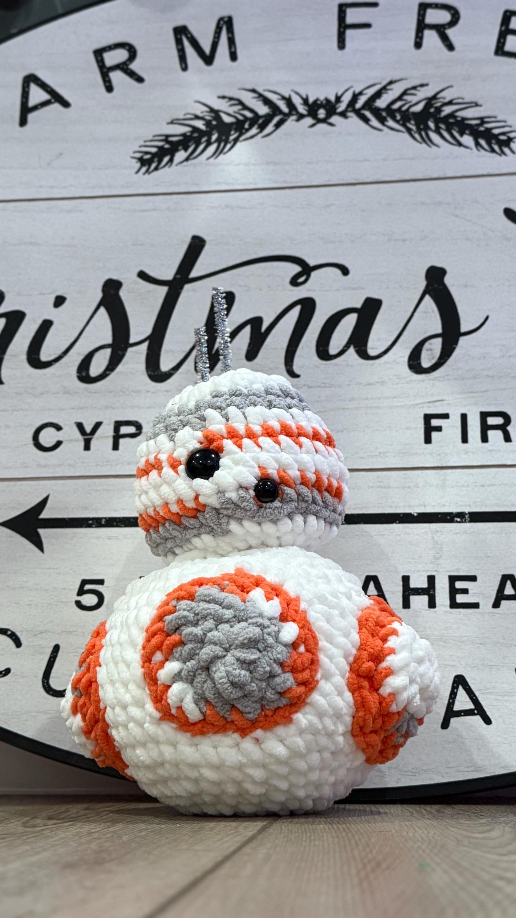 Cute handmade crochet robot plushie, a perfect gift for sci-fi fans and collectors.
