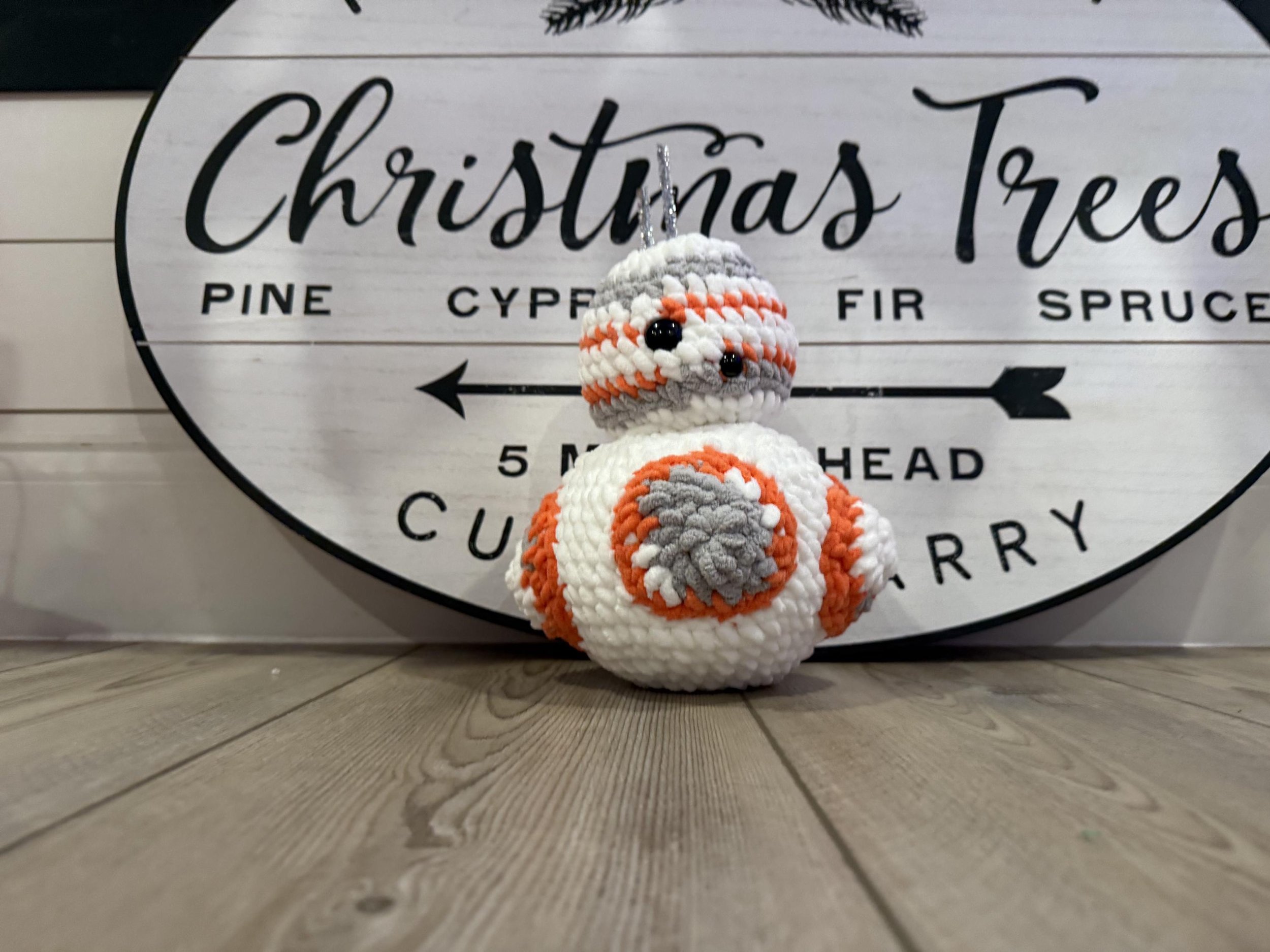 Cute handmade crochet robot plushie, a perfect gift for sci-fi fans and collectors.