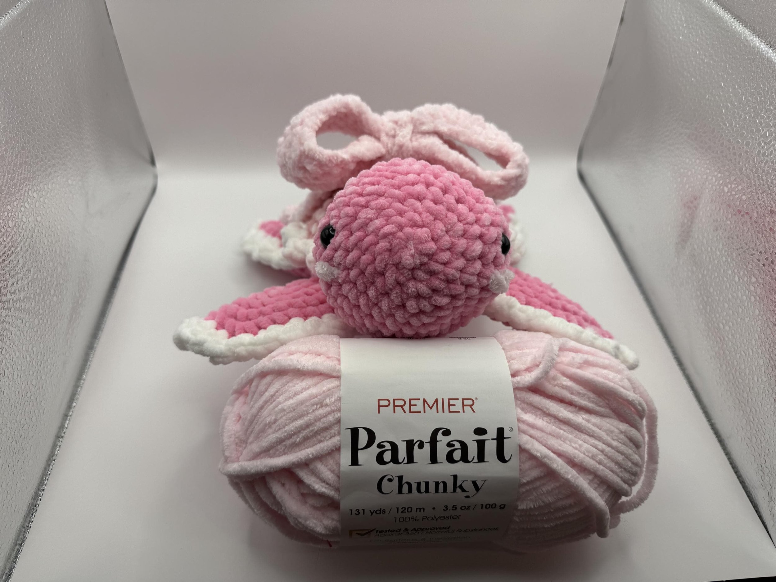 Adorable handmade crochet turtle plushie with a cute pink bow, perfect for gifts and decor.