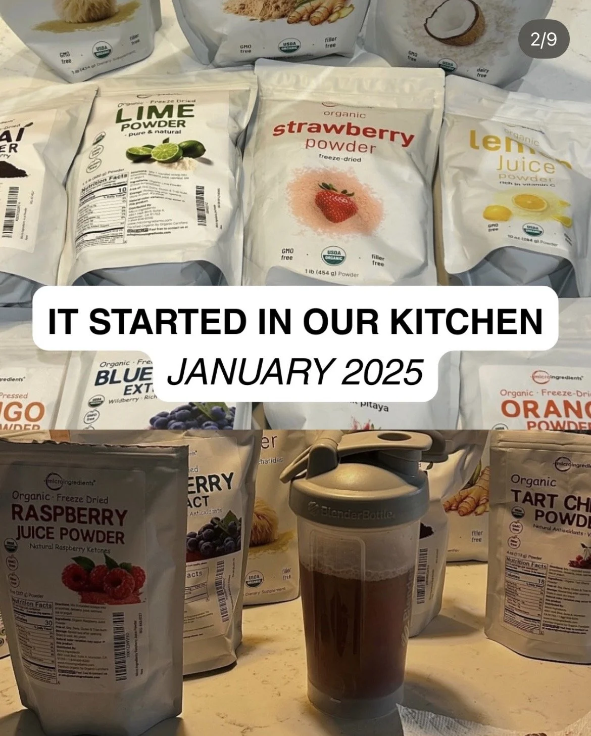 Organic freeze-dried fruit and ingredient powders spread across a kitchen counter beside a BlenderBottle during early CHARGE formulation