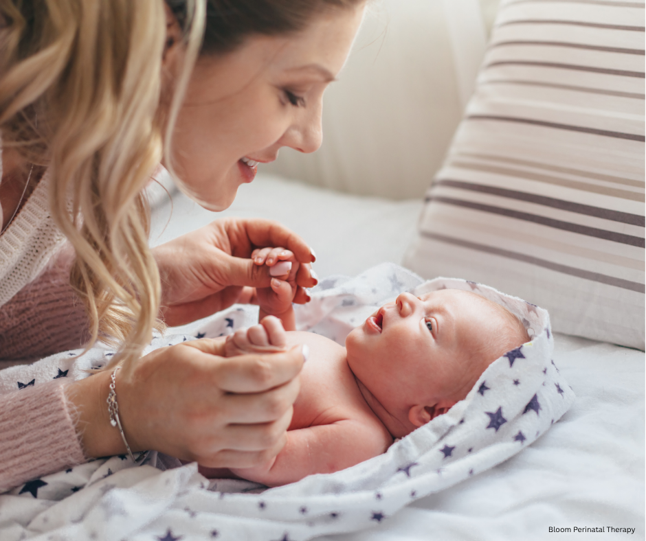 Mother bonding with her baby after receiving support during the postpartum period.