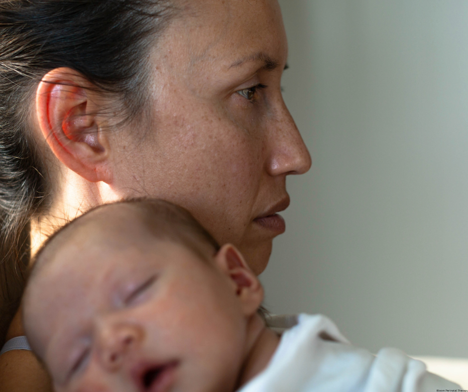Mother experiencing emotional distress during the postpartum period while caring for her baby