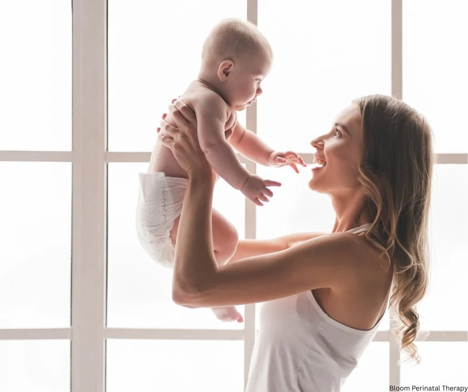 Mother feeling emotionally supported and connected with her baby after postpartum recovery.