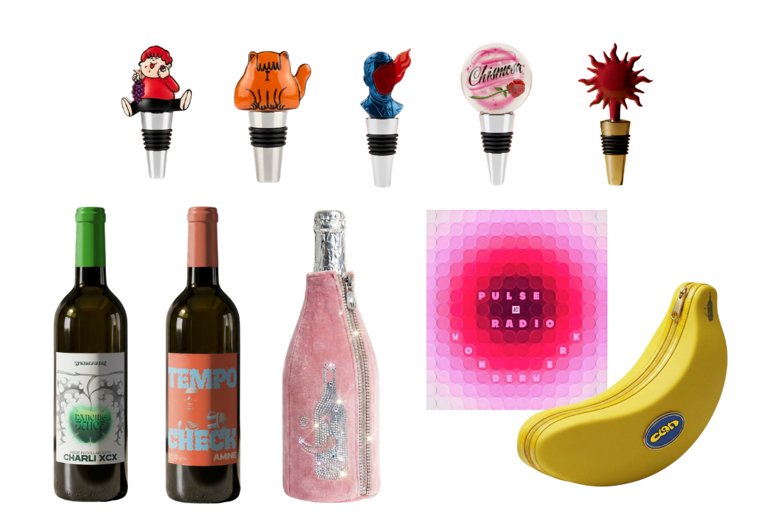 Collection of novelty items including four colorful toy lollipops, two bottles of wine, a pink bottle-shaped sparkly case, a pink and purple pulse radio, a bunch of bananas, and a pink zippered bag.