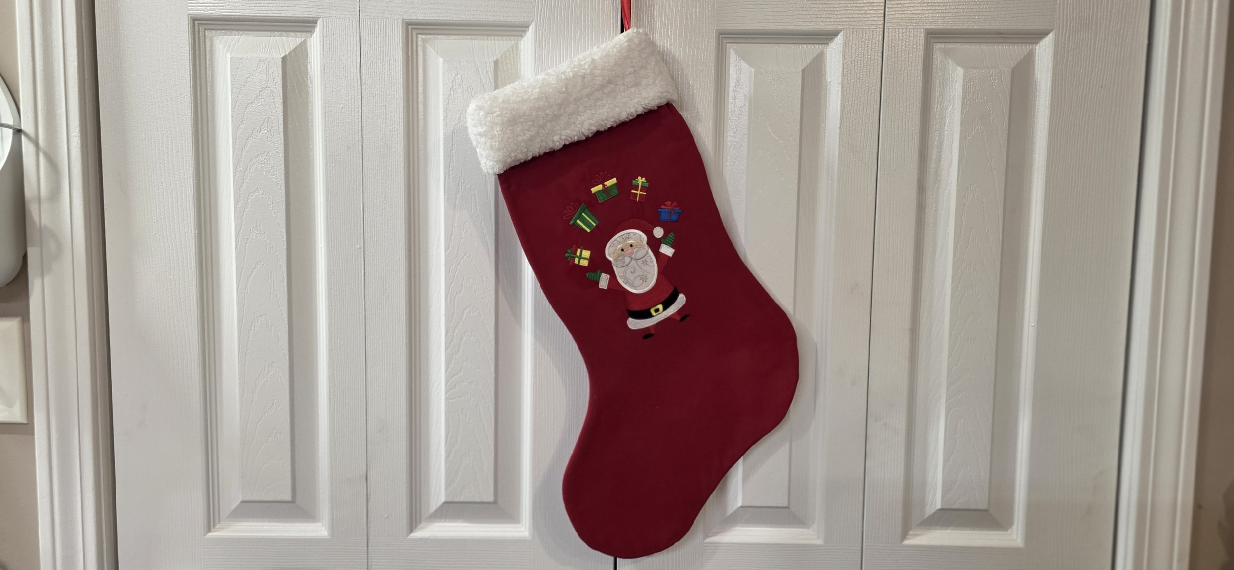 Santa with presents embroidered stocking