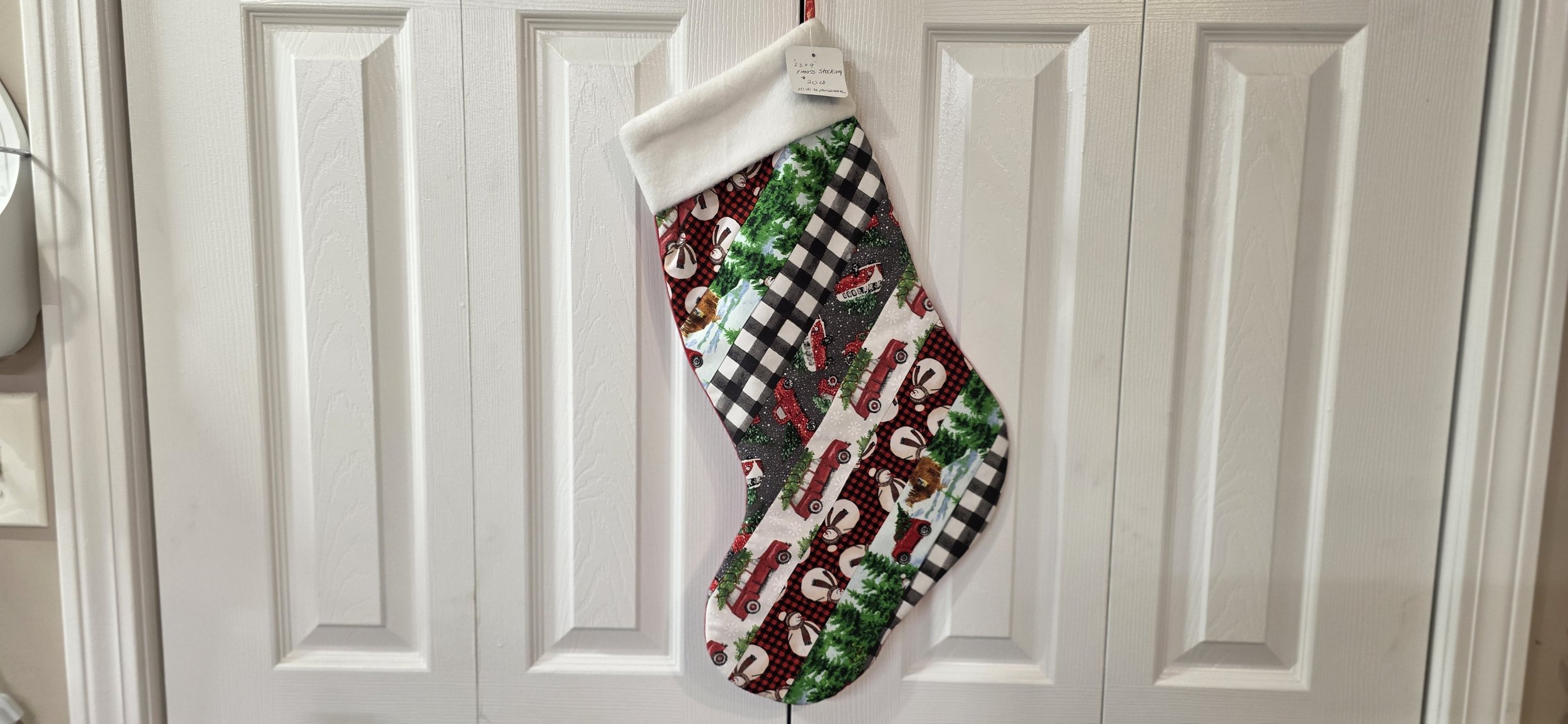 Jelly roll stocking with red backing. Hangs to the left direction.