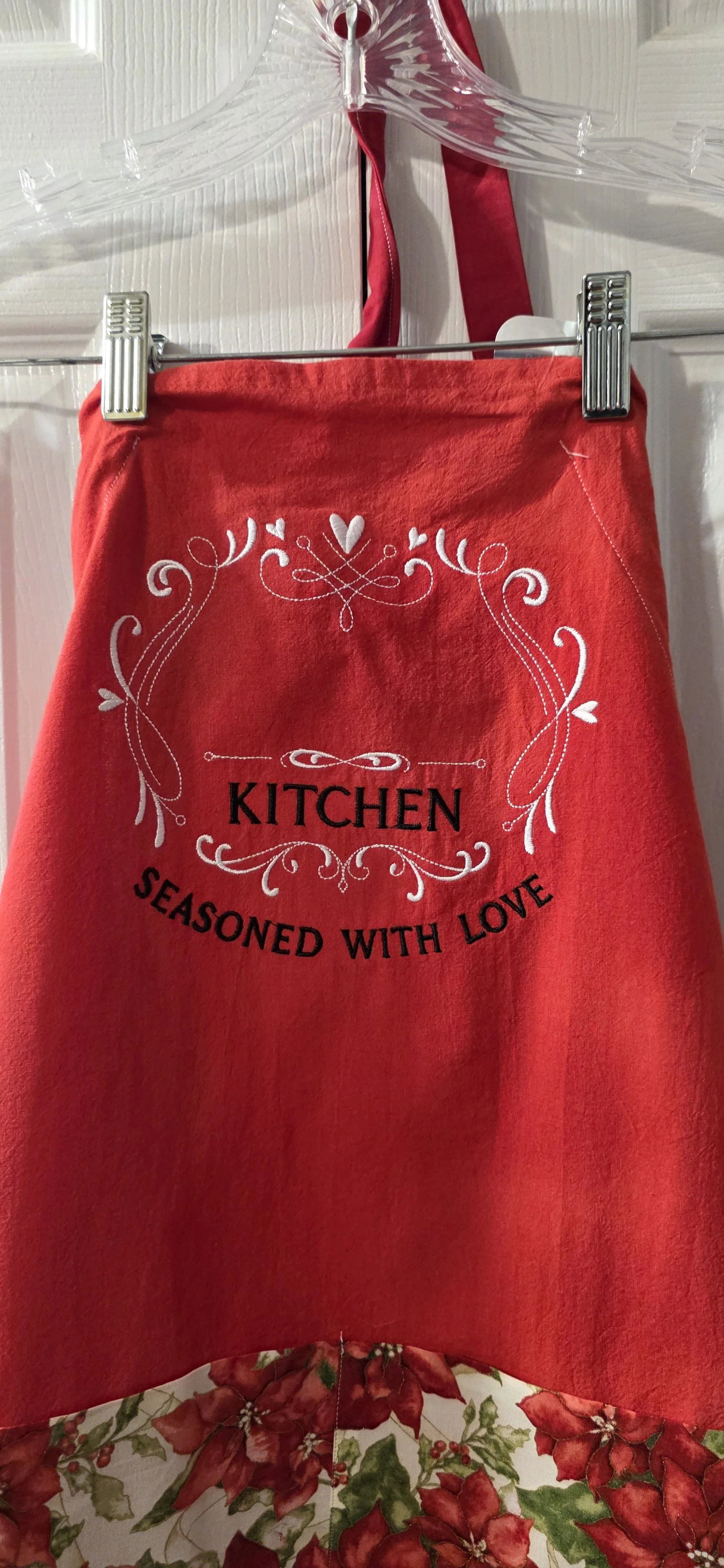 Adjustable tea towel apron. Embroidered with Kiichen seasonsed with love. This apron has a cloth flora pocket.  Add a name to it at an additional cost.