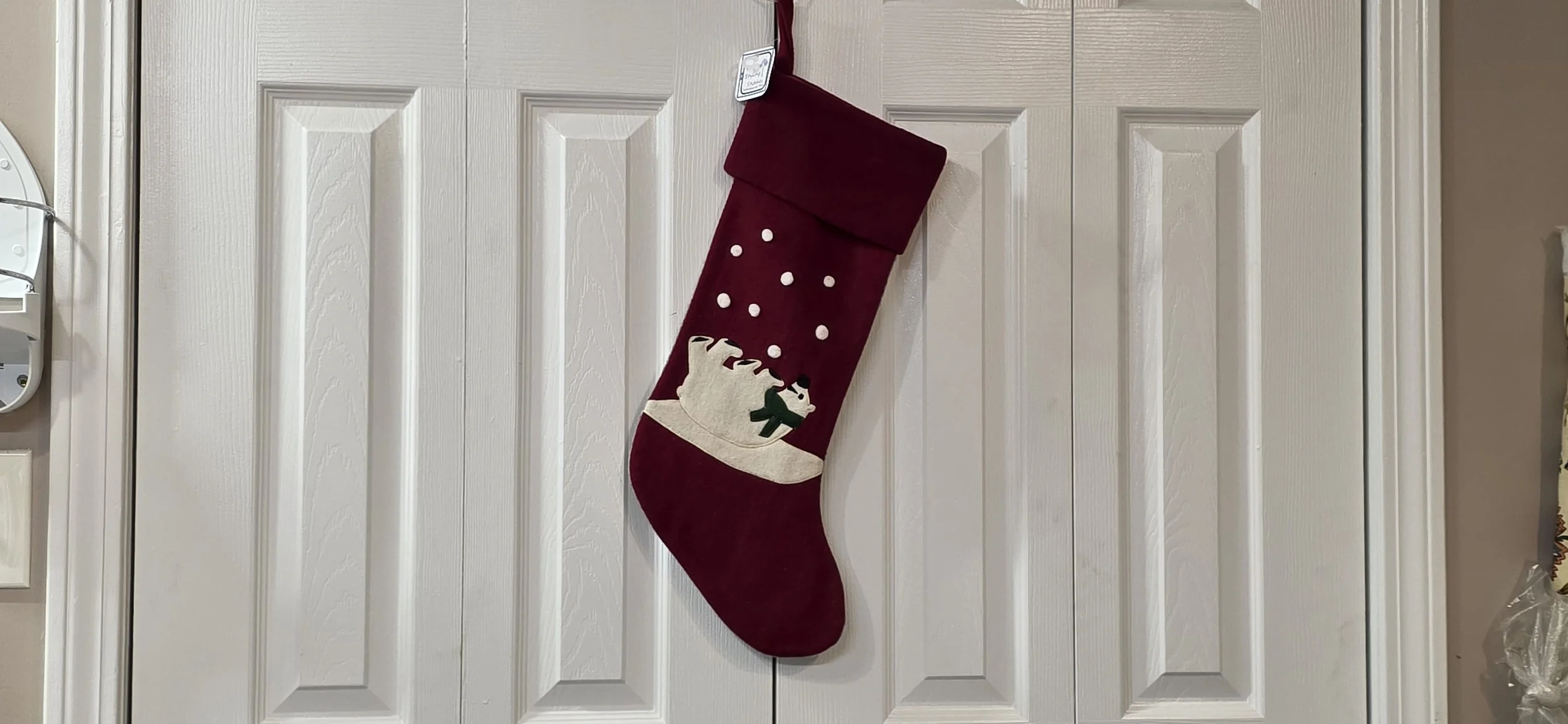 Vintage red crate and barrel stocking with with felt polar bear.