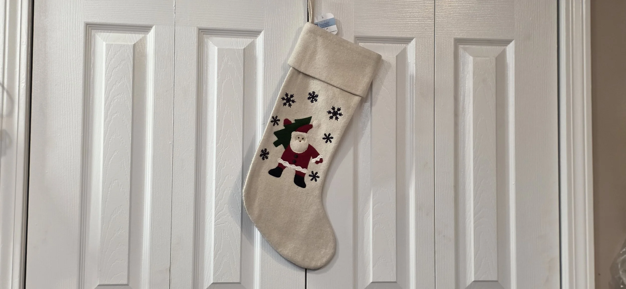 White santa vintage crate and barrel felt stocking.