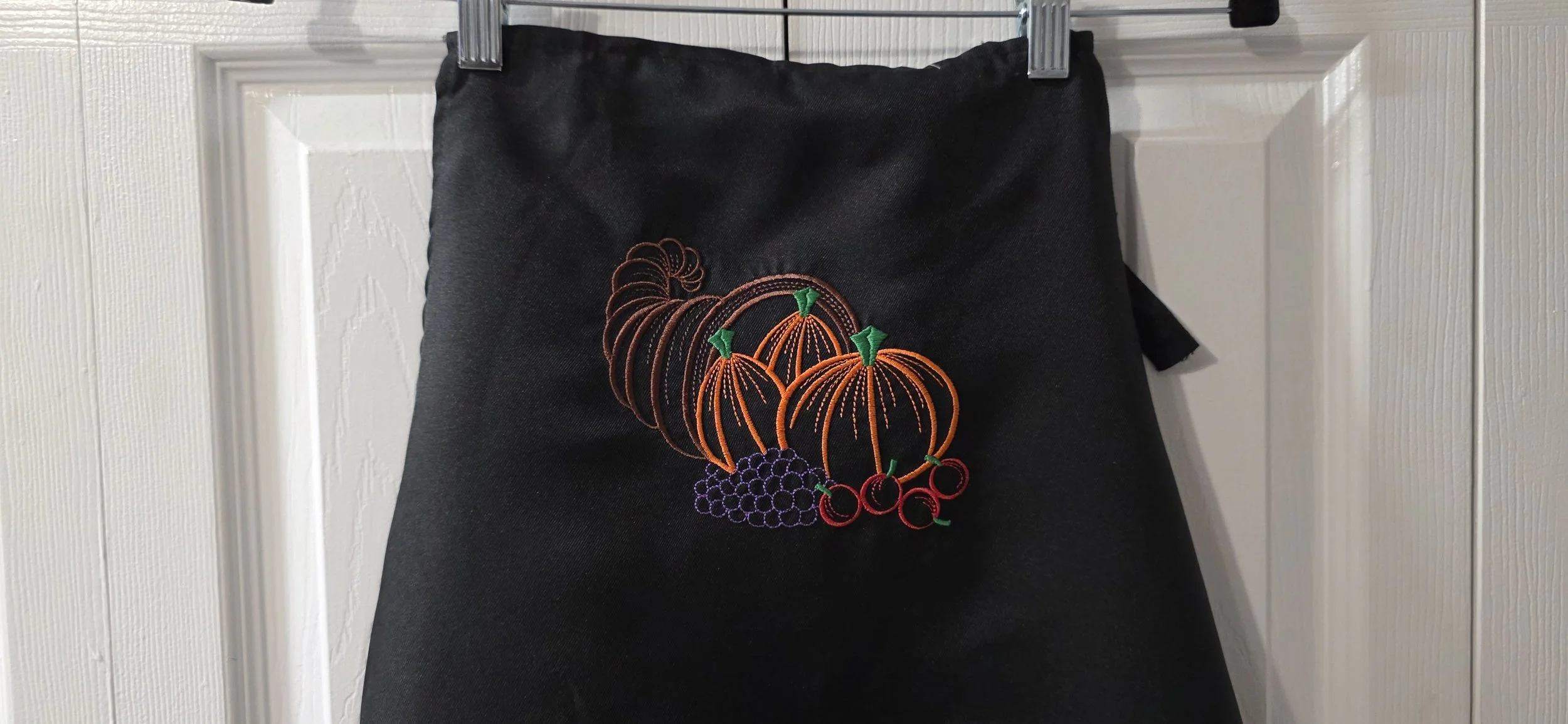 Black embroidred pumpkin apron