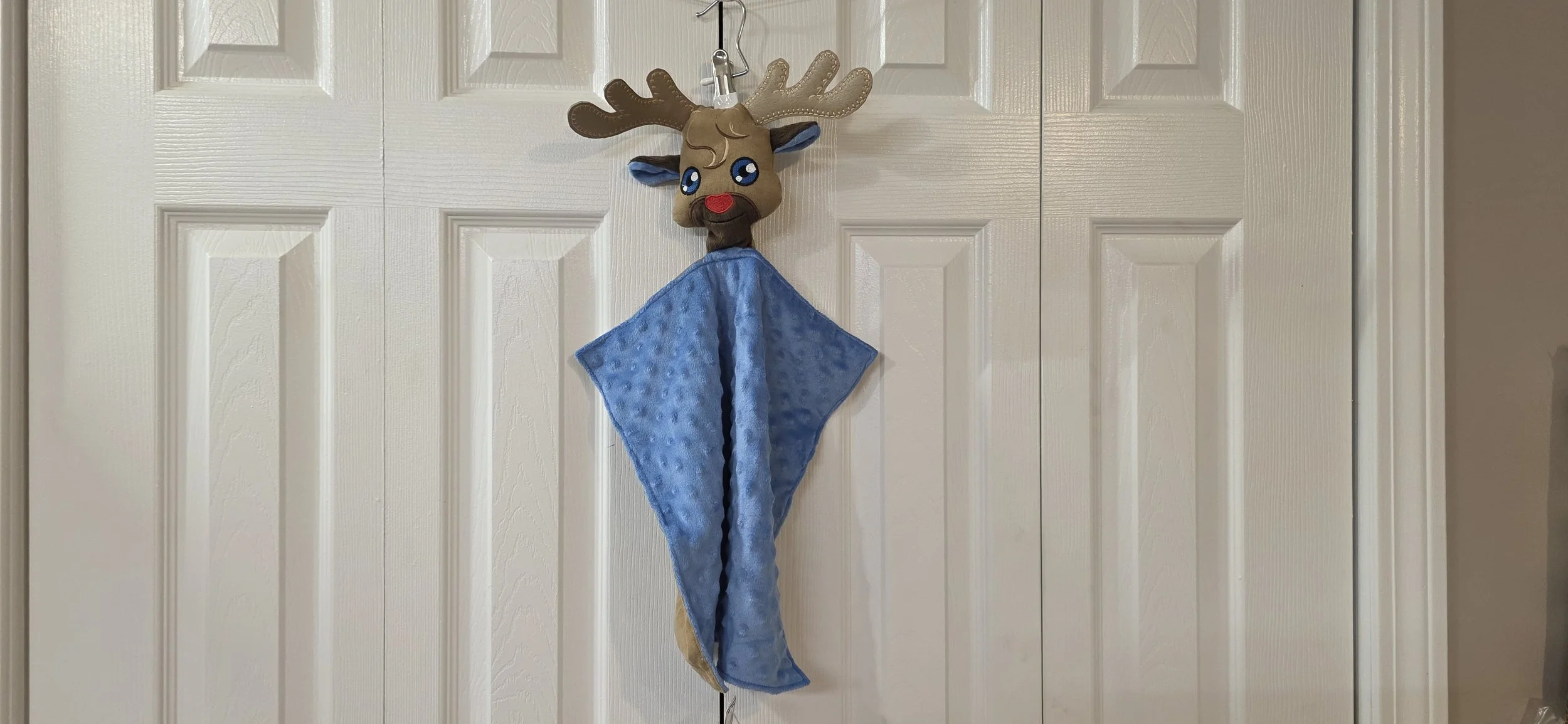 Brown and blue in the hoop embroidered reindeer lovey  with rattle.