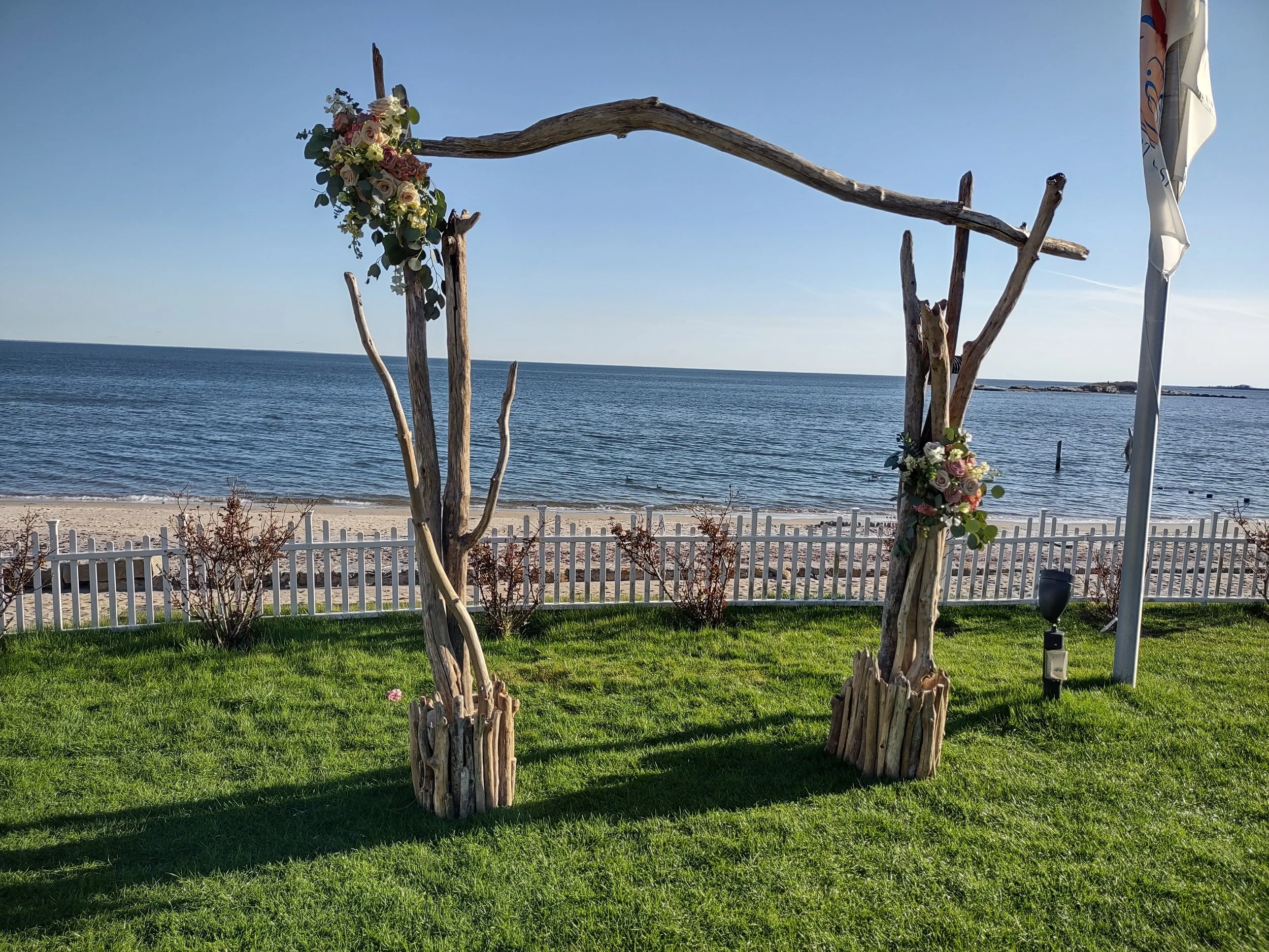 Coastal ceremony arch decor