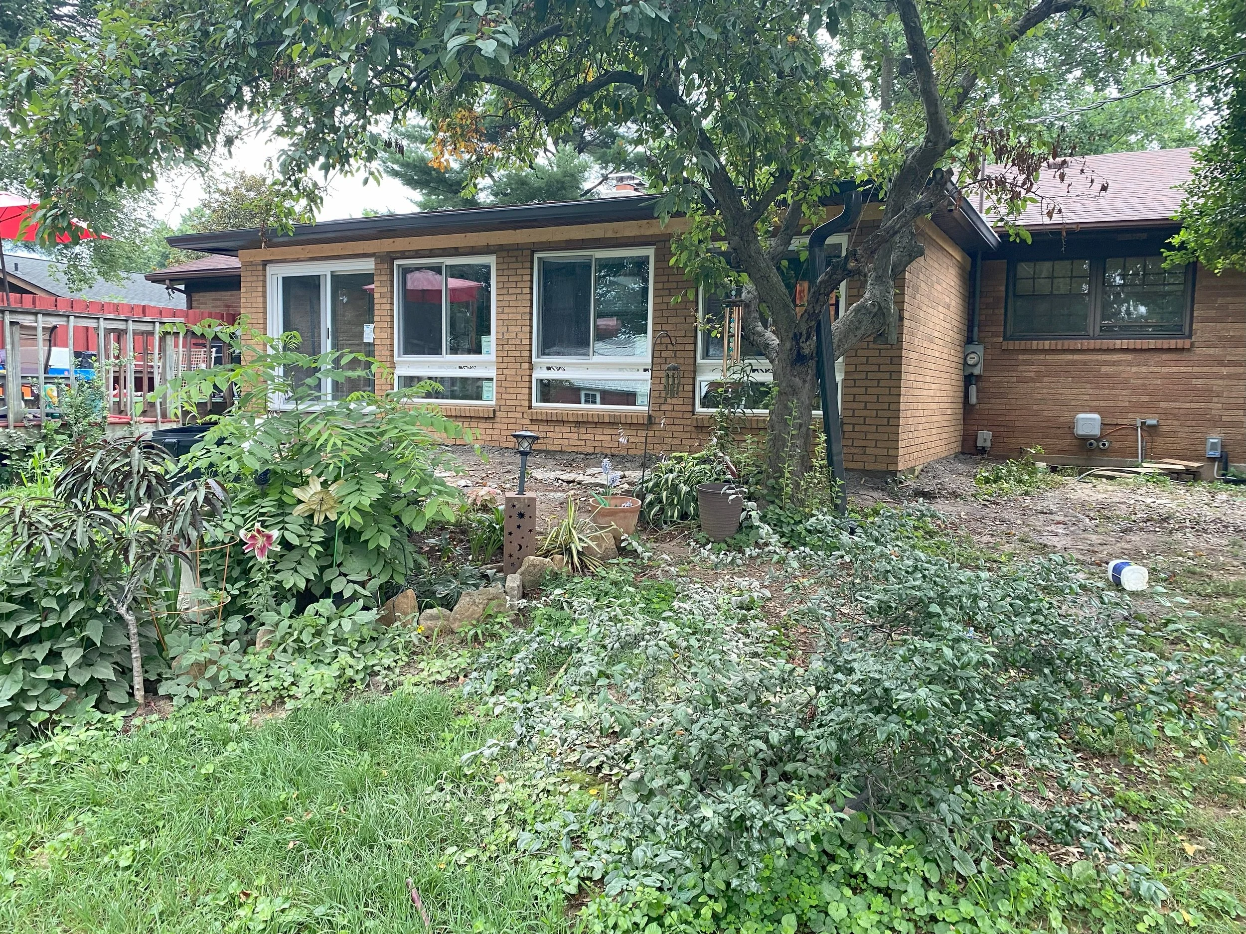 Residential property featuring an added living space designed to blend with the original home by Esarey Construction