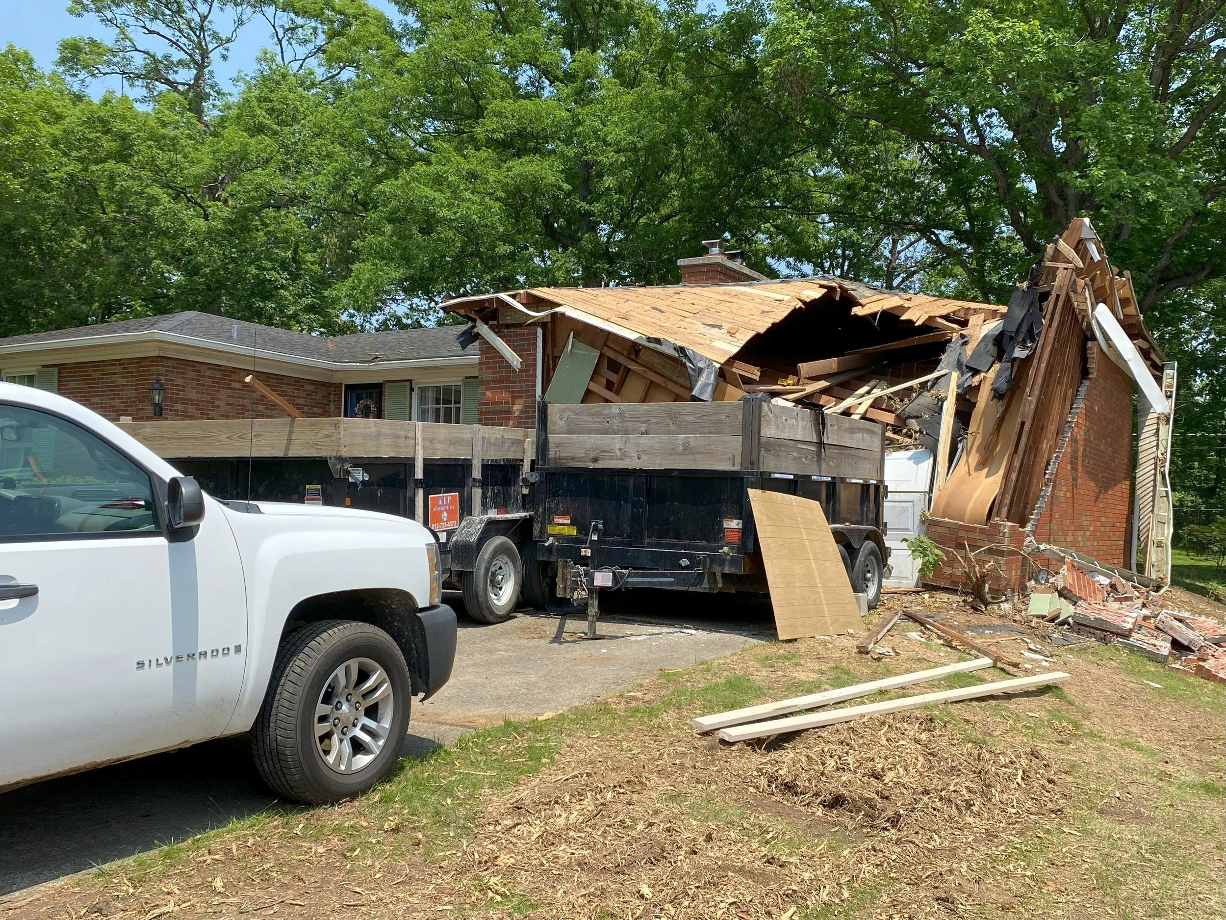 Property site following severe weather showing debris removal and full restoration work by Esarey Construction in Jeffersonville, Indiana 47130