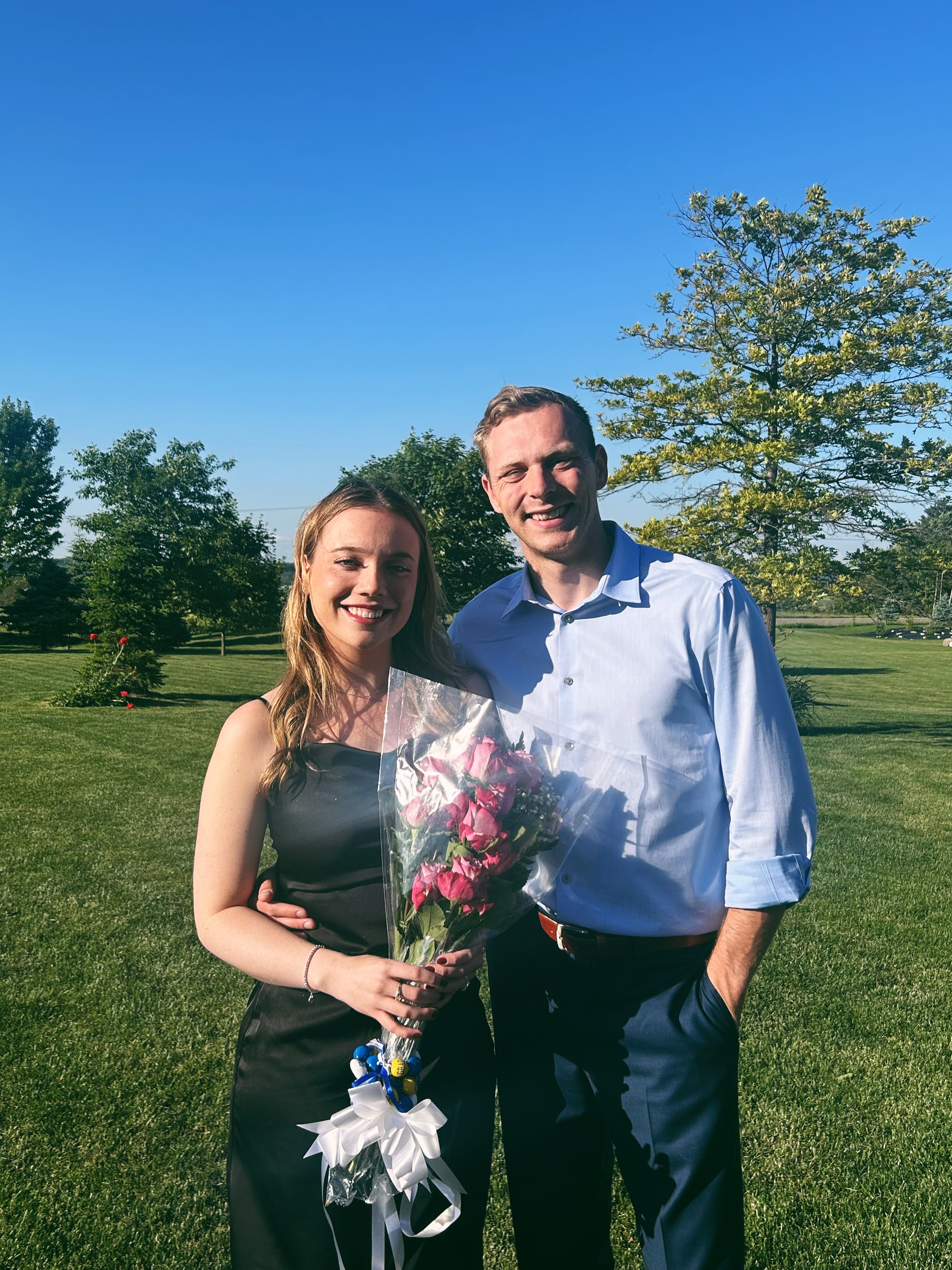Mackenzie and Brett celebrating her graduation