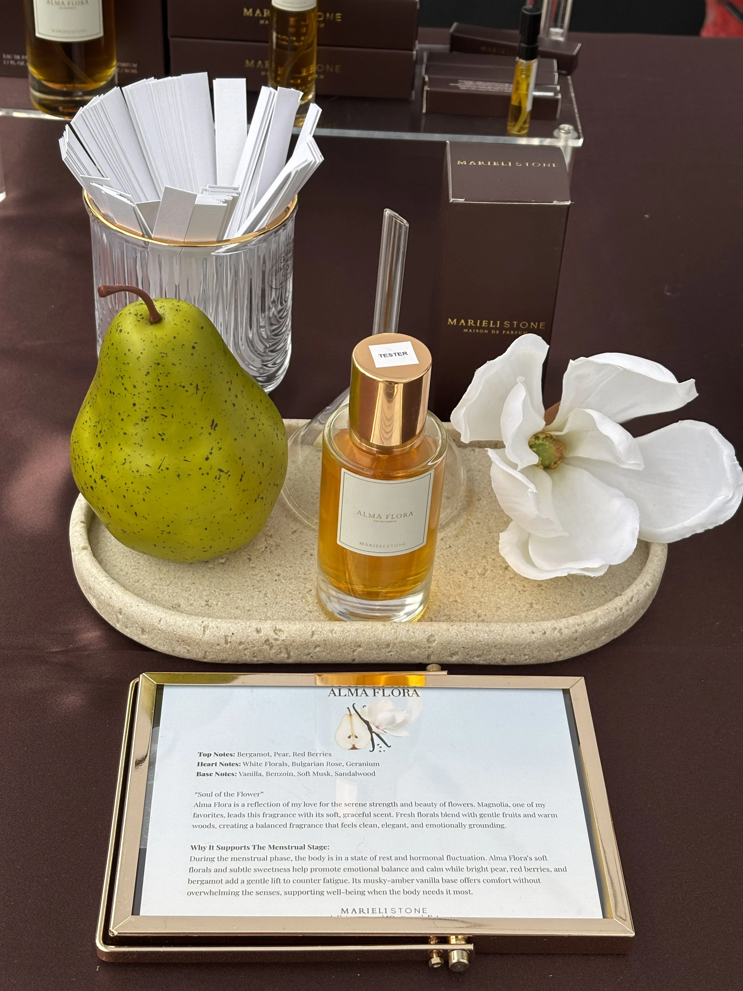Nontoxic floral perfume, along with a pear, white flower. Nontoxic musk perfume