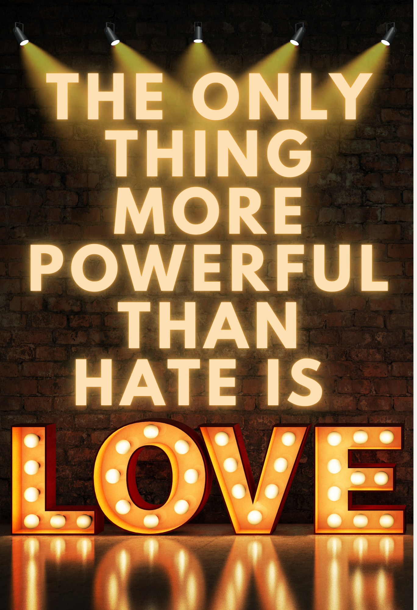 Brightly lit sign on a brick wall reads: "The only thing more powerful than hate is love," with the word "LOVE" in large, illuminated letters at the bottom.