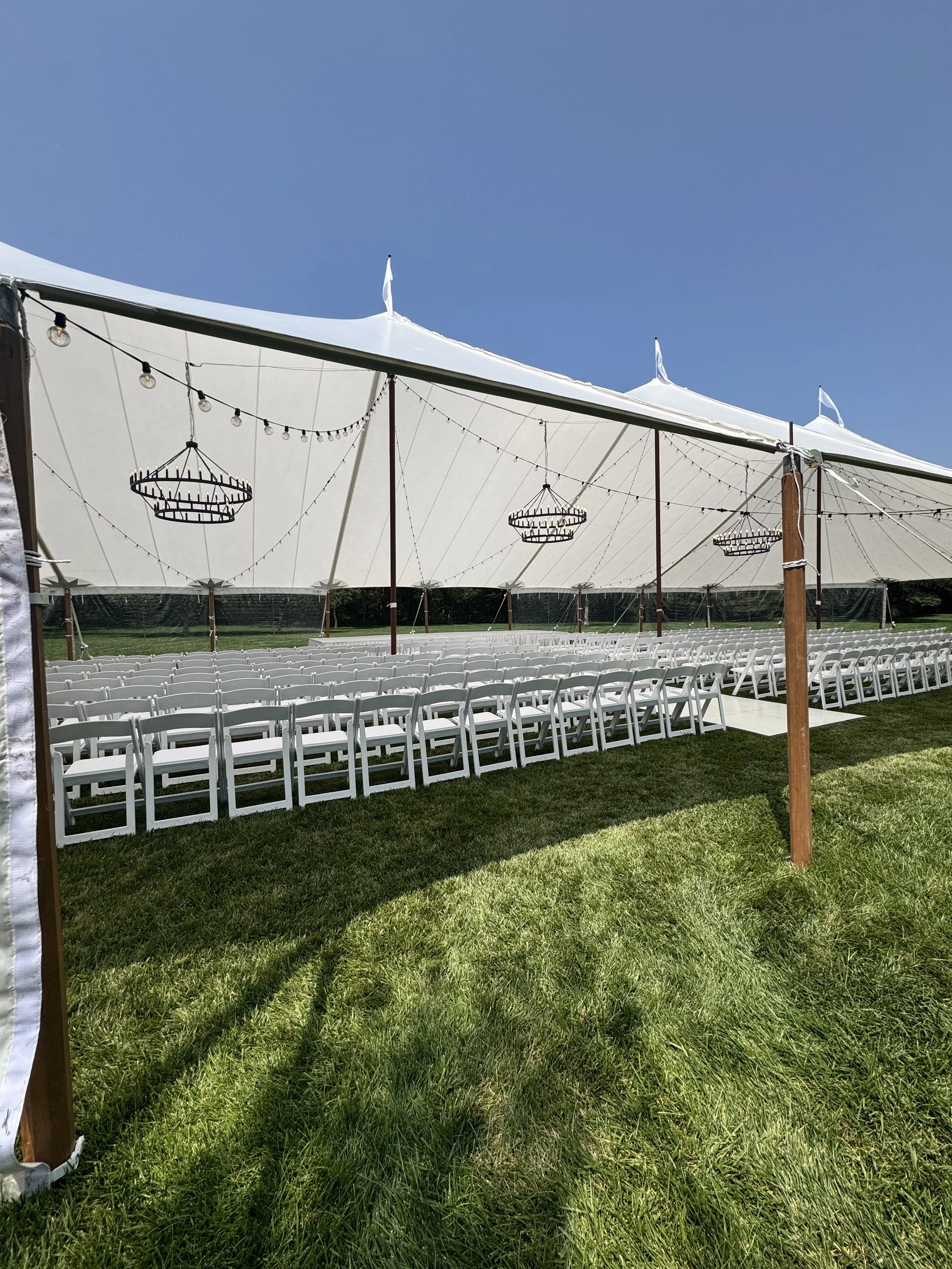 Rows of white folding chairs.