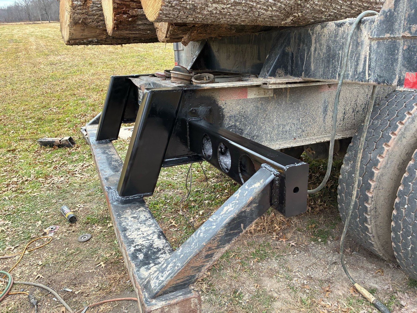 If you're a logger, you know you push on these trailers with dozers to get them out of the mud...unfortunate reality - these trailers aren't made for the hard life of being a logger.

We replaced the broken, flimsy, factory bumper framing with thicke