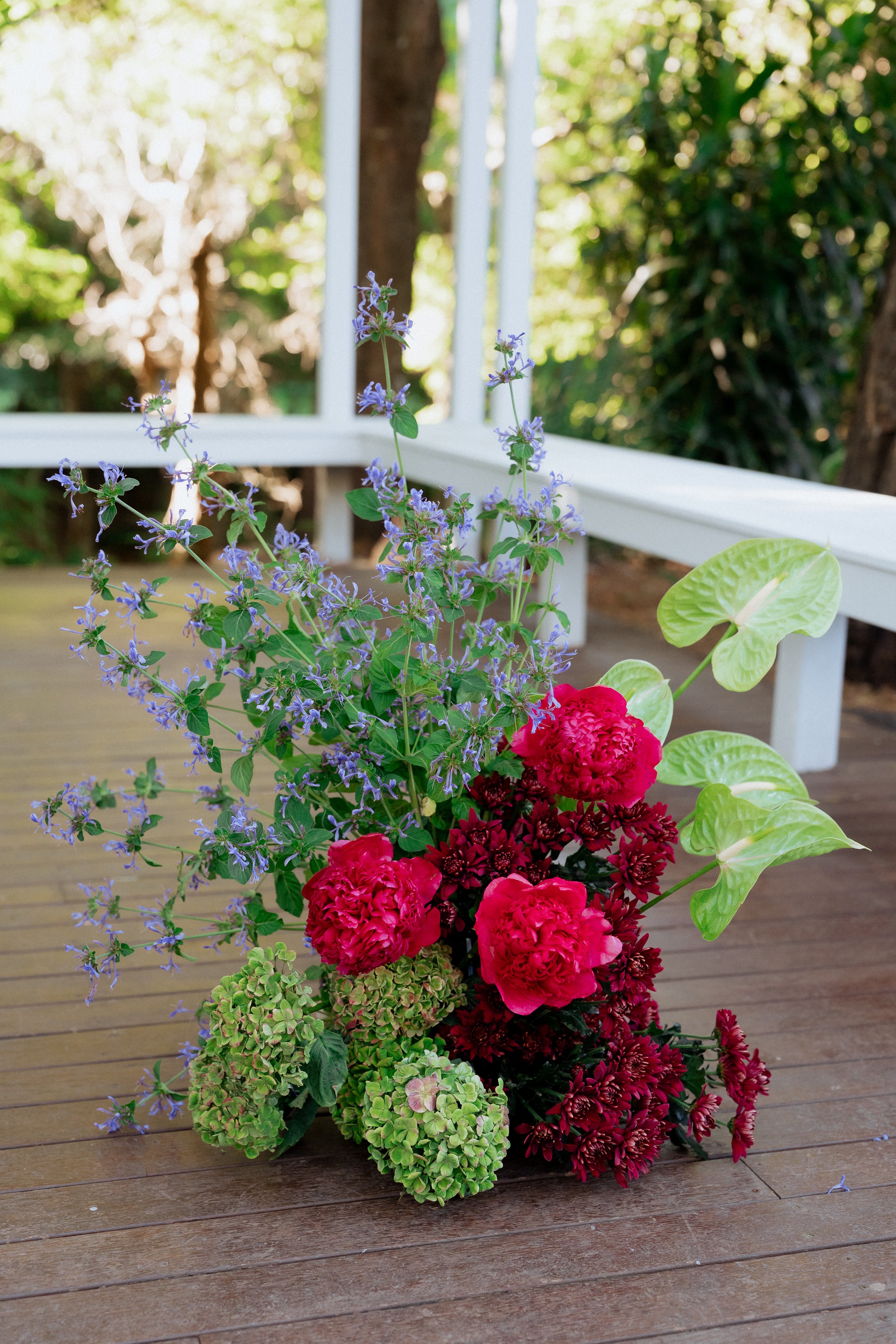 Colourful moody modern wedding ceremony florals at The Lodge Jamberoo