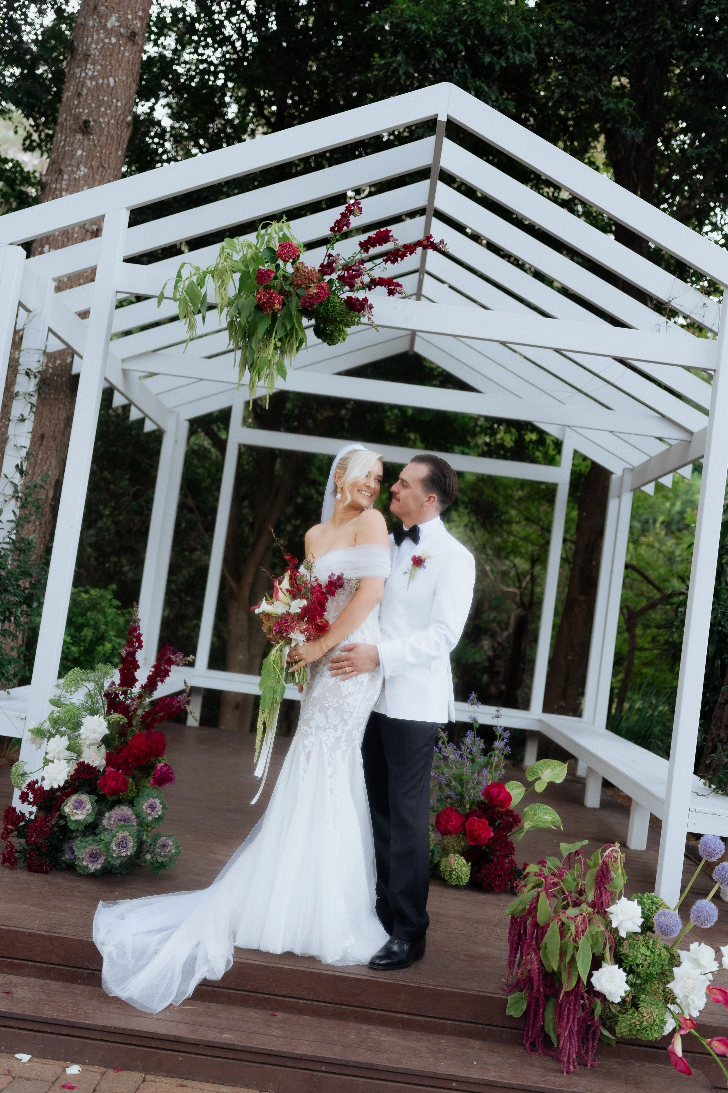 Colourful moody modern wedding ceremony florals at The Lodge Jamberoo