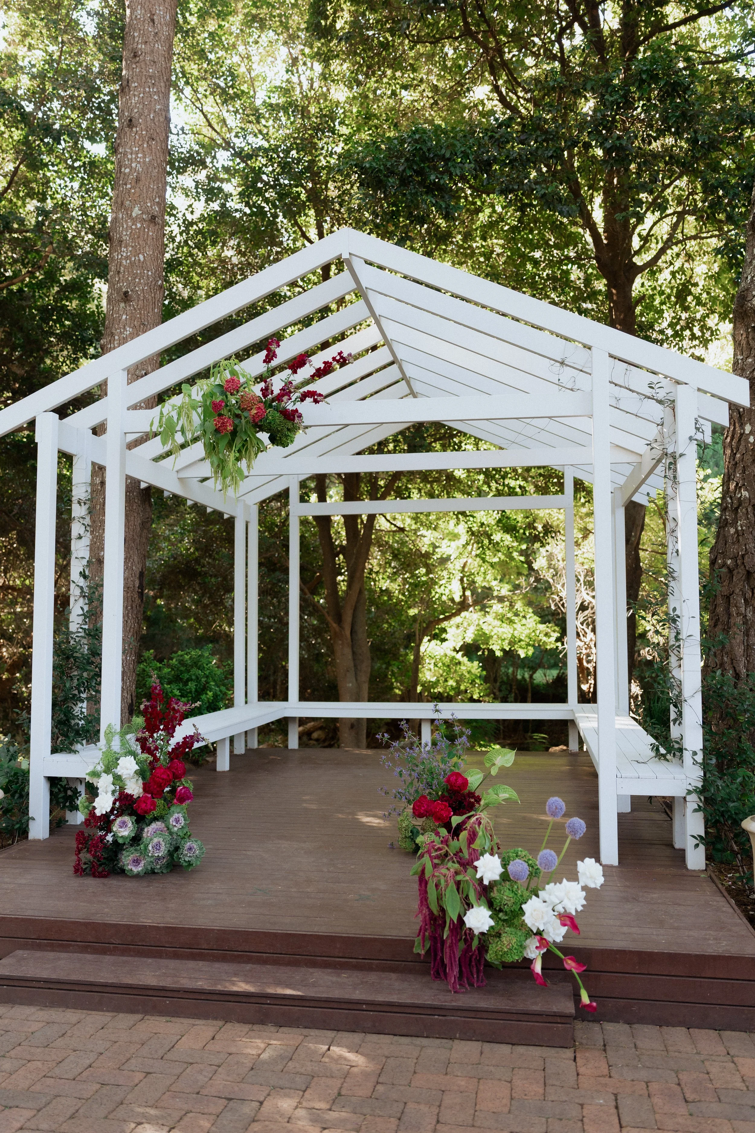 Colourful moody modern wedding ceremony florals at The Lodge Jamberoo